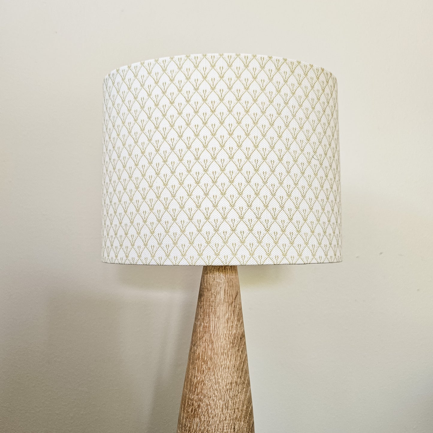 Rosemary fabric swatch in a trellis‑style cotton‑linen fabric by ZIA LIVING, a repeating lino‑print motif on a neutral background. Featured on a lampshade