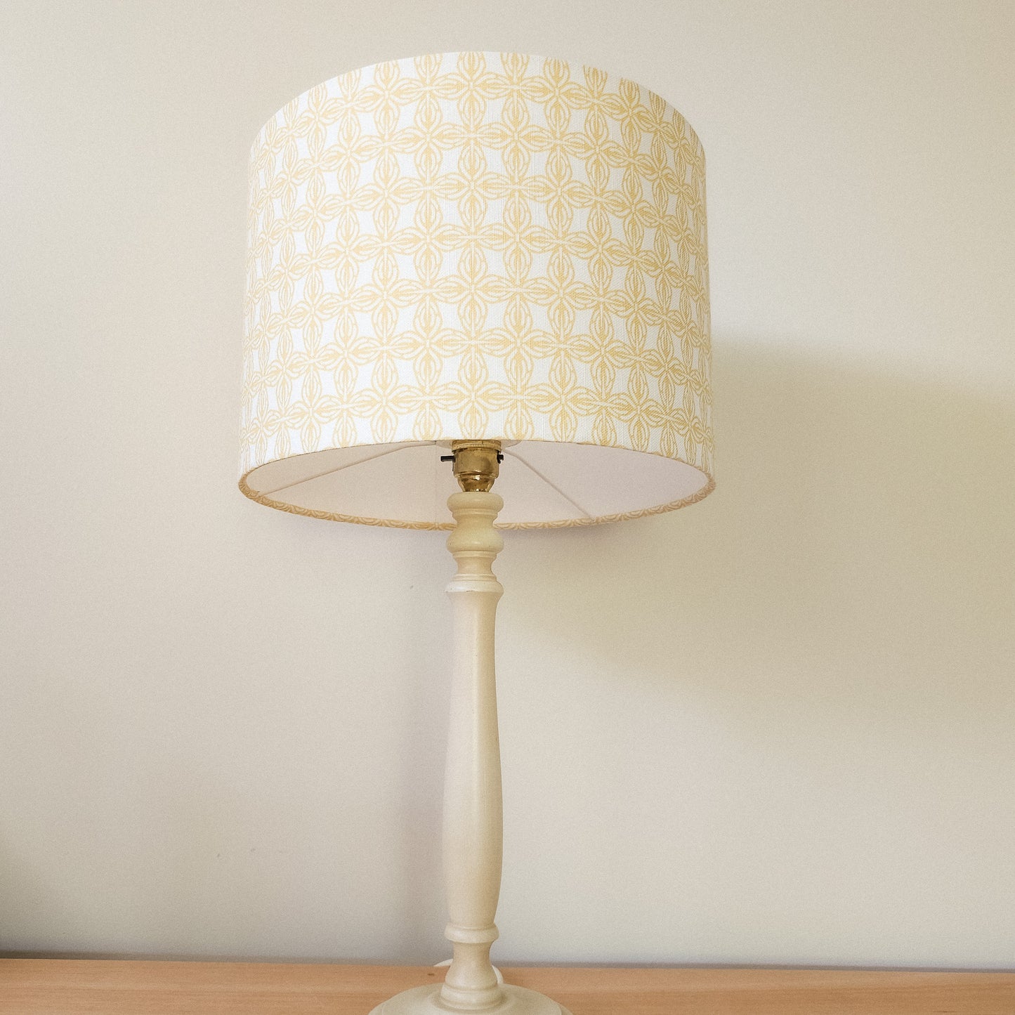 Bella Classic in yellow/white geometric pattern fabric swatch, handmade in cotton‑linen, featured on a lampshade — ZIA LIVING.