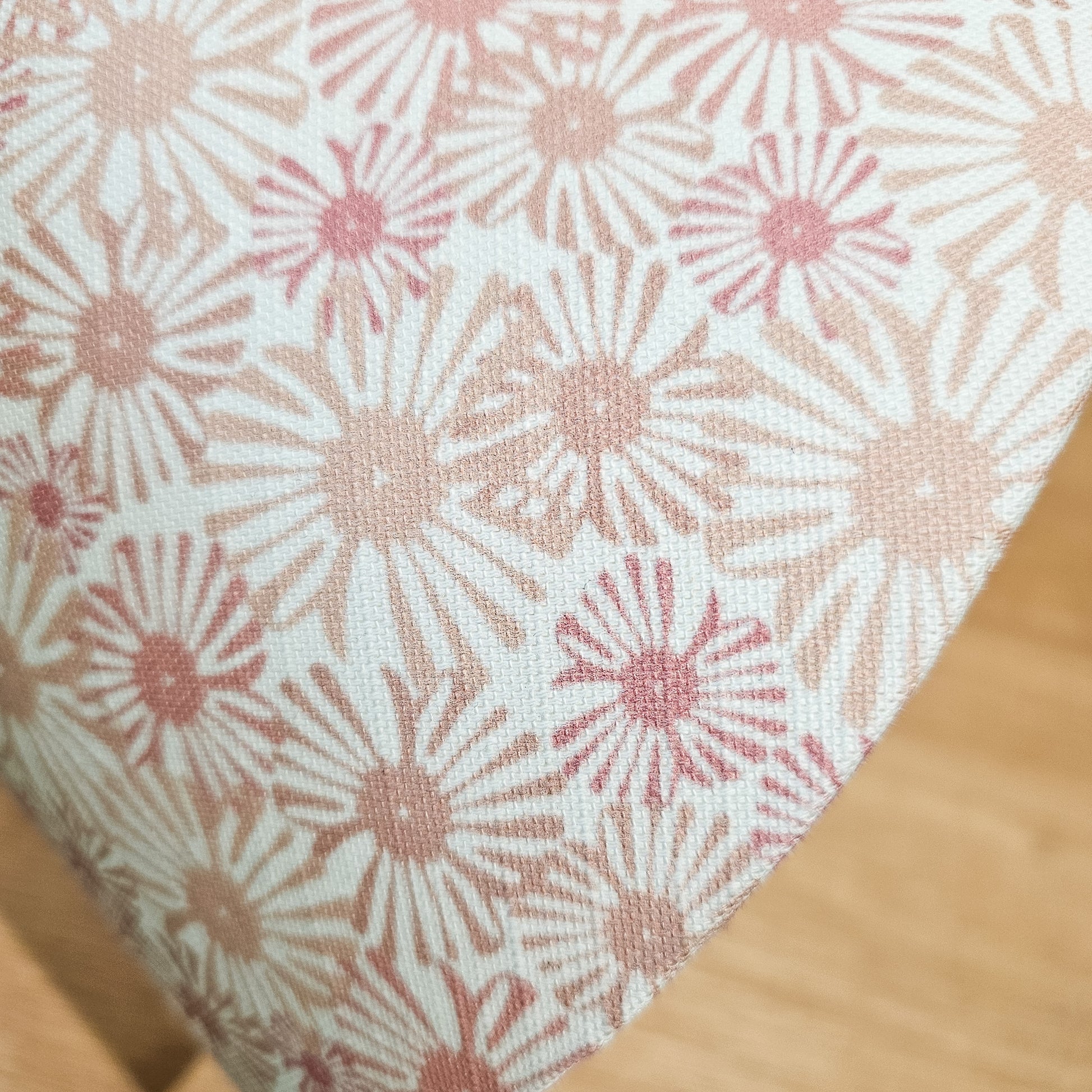 Close up of conical lampshade in Pink Daisy floral fabric on wooden surface — artisan home décor by ZIA LIVING.