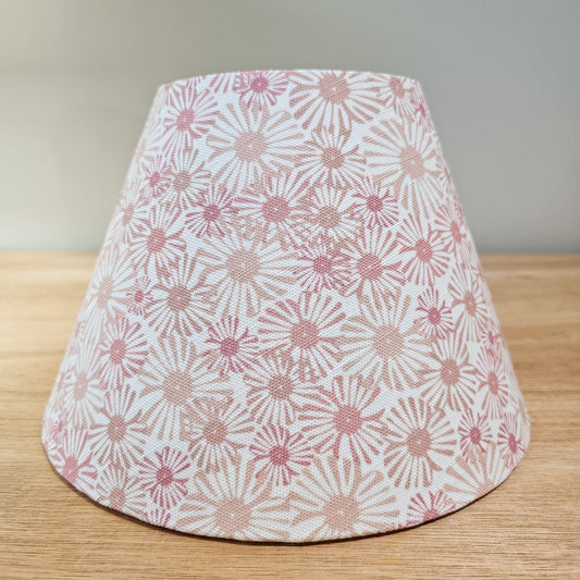 Handmade conical lampshade in Pink Daisy floral fabric on a wooden surface — artisan home décor by ZIA LIVING.