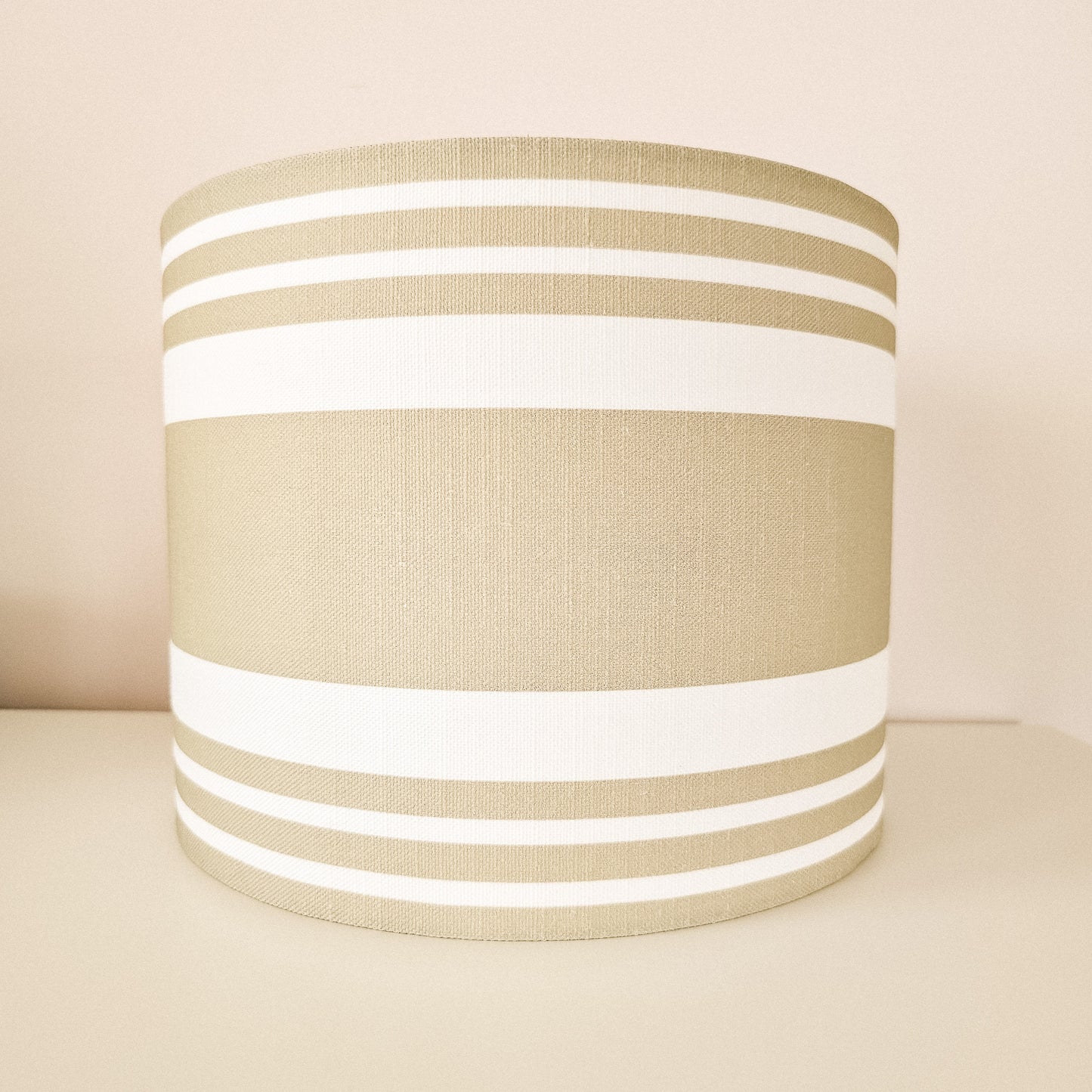 Handmade drum lampshade in Harbour Stripe fabric on neutral background — artisan home décor by ZIA LIVING.
