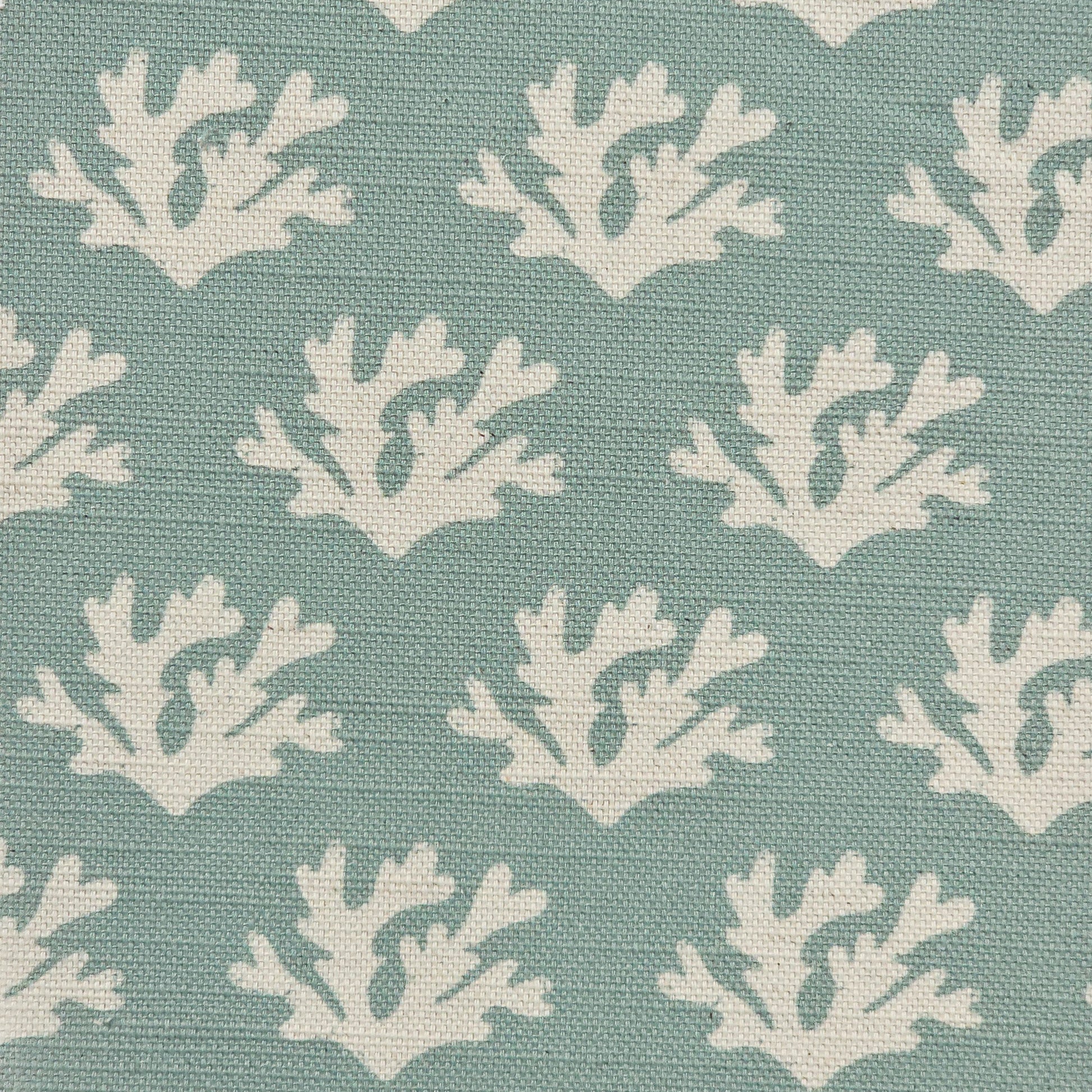 Seaweed cotton linen fabric featuring white lino print seaweed motifs in a repeating coastal pattern on a soft mineral coloured  background. ZIA LIVING.