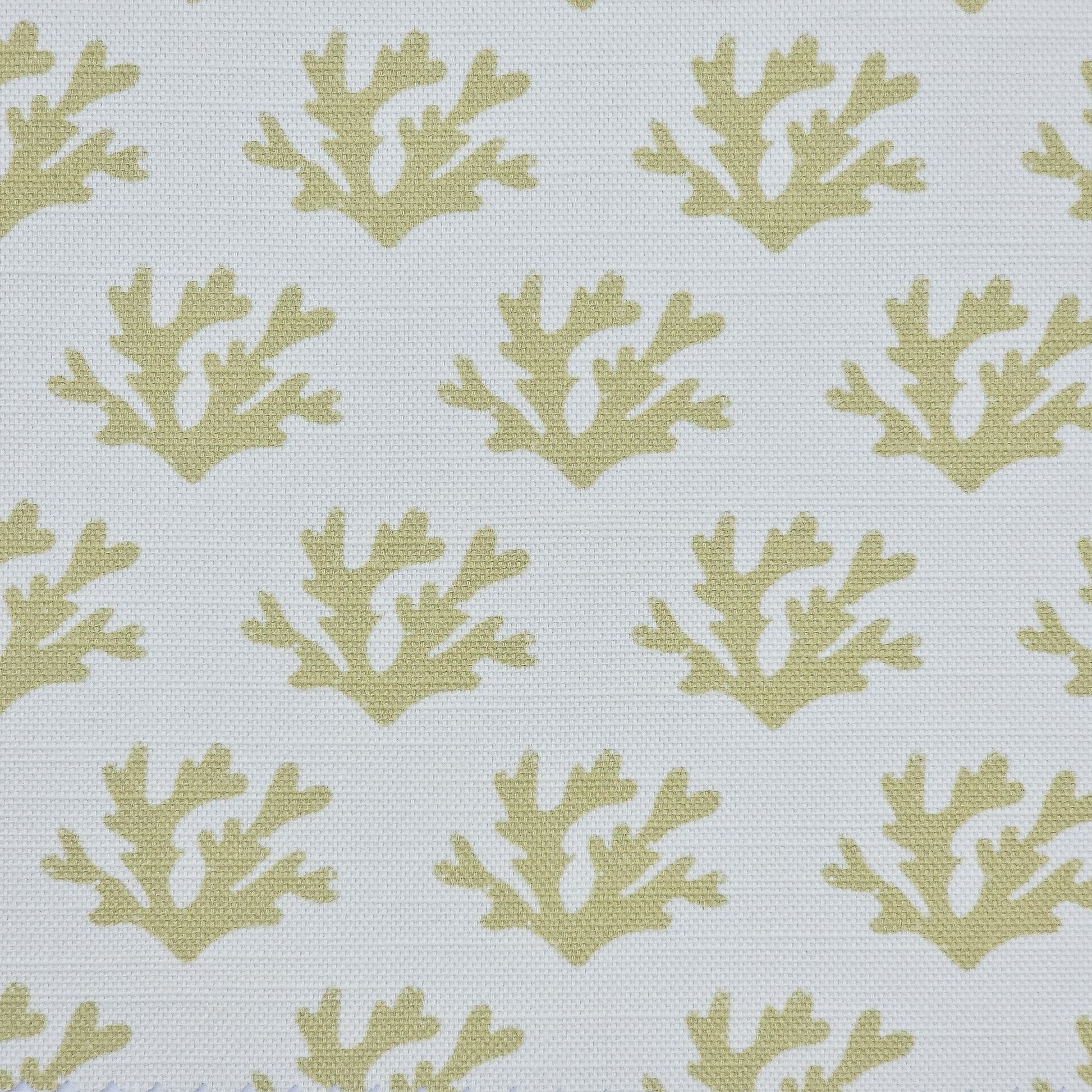 Green Seaweed cotton linen fabric featuring sand coloured hand carved lino print seaweed motifs in a repeating coastal pattern on a soft white background. ZIA LIVING.
