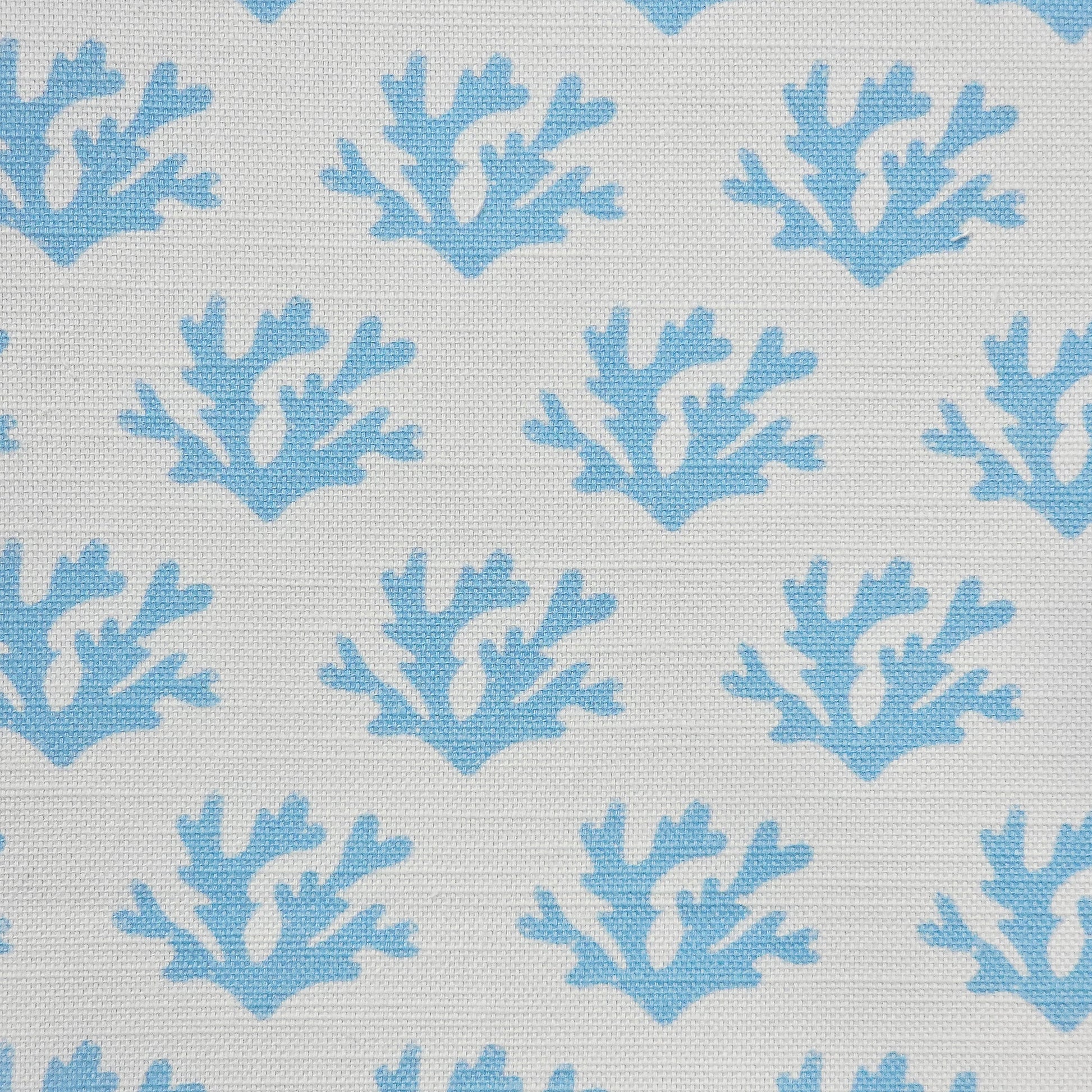 Sky Blue Seaweed cotton linen fabric featuring sky blue coloured hand carved lino print seaweed motifs in a repeating coastal pattern on a soft white background. ZIA LIVING.