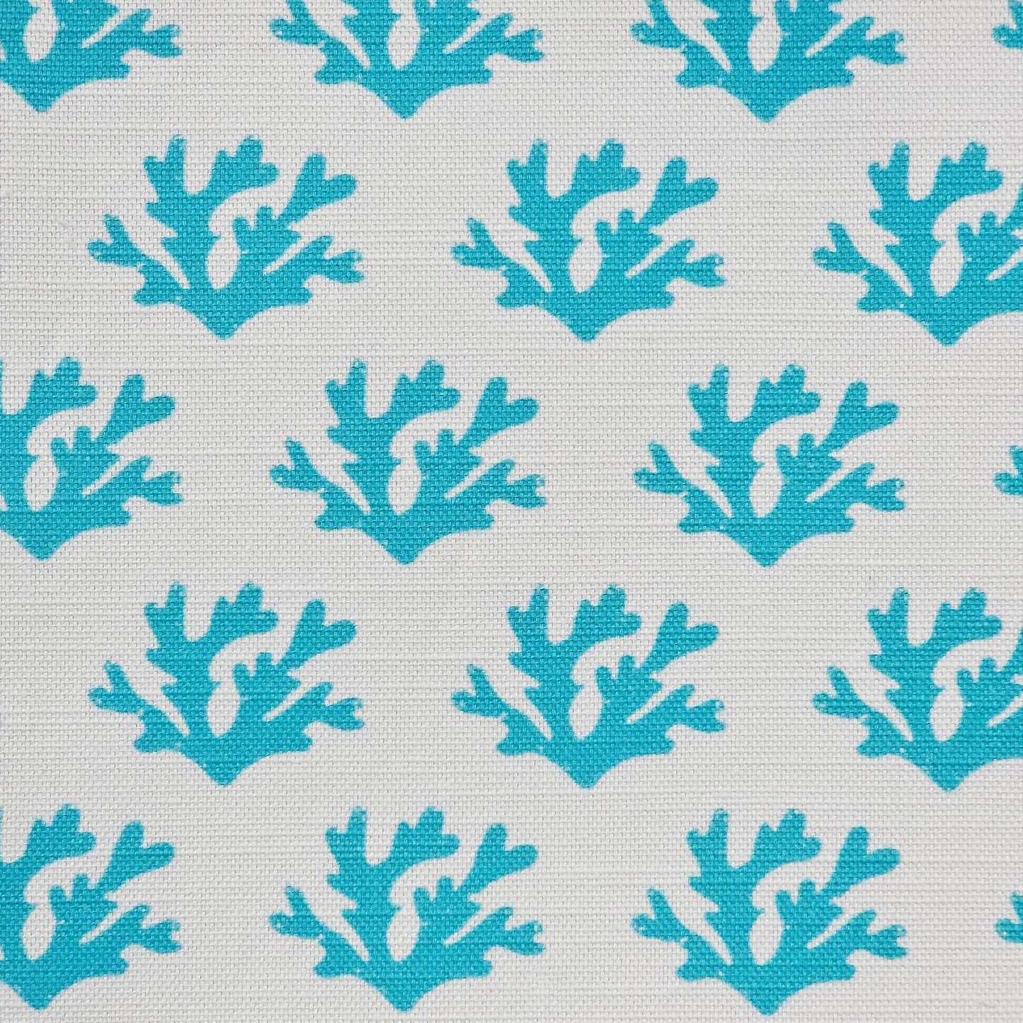Teal Seaweed cotton linen fabric featuring teal coloured hand carved lino print seaweed motifs in a repeating coastal pattern on a soft white background. ZIA LIVING.