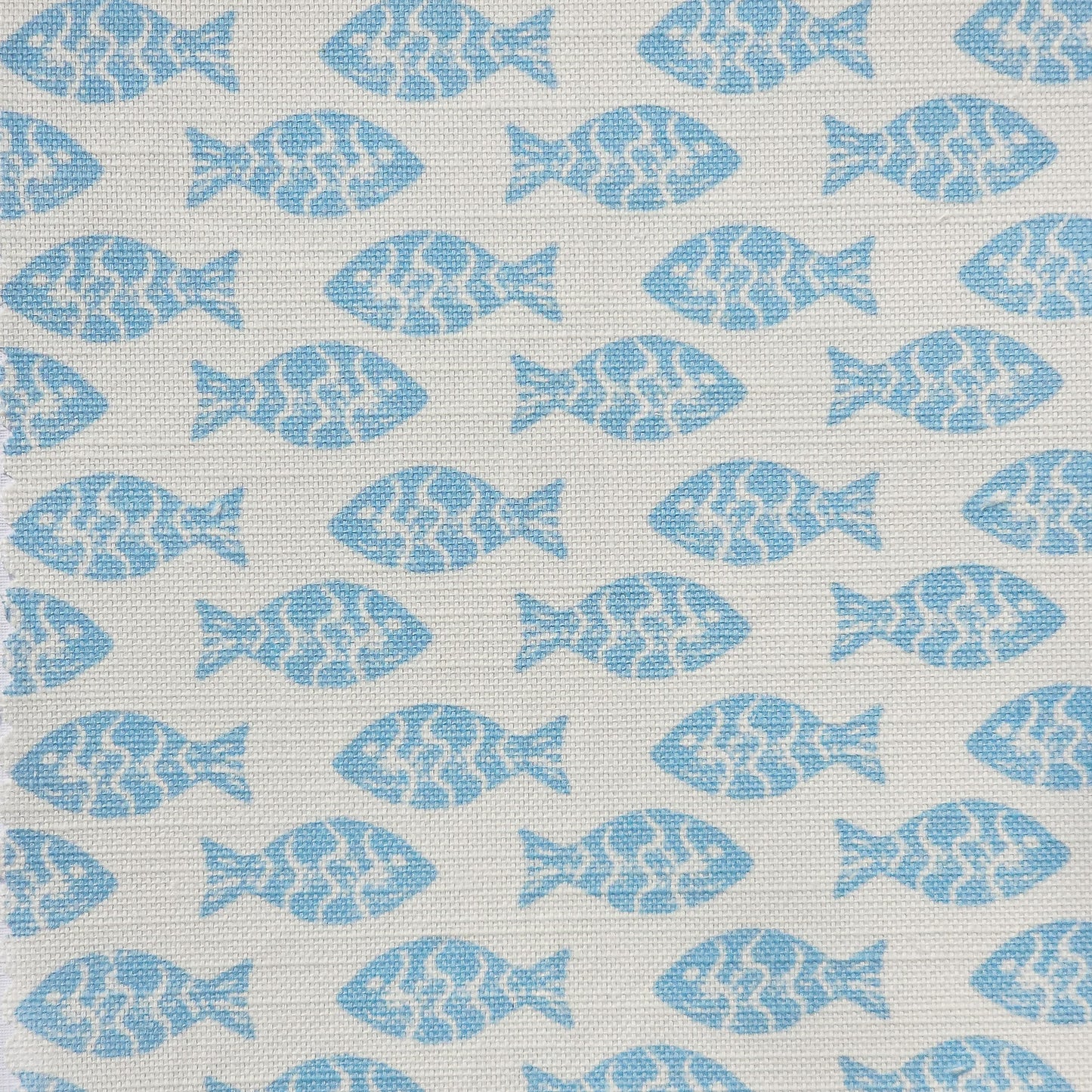 Pattern of blue fish shapes on a light white fabric background