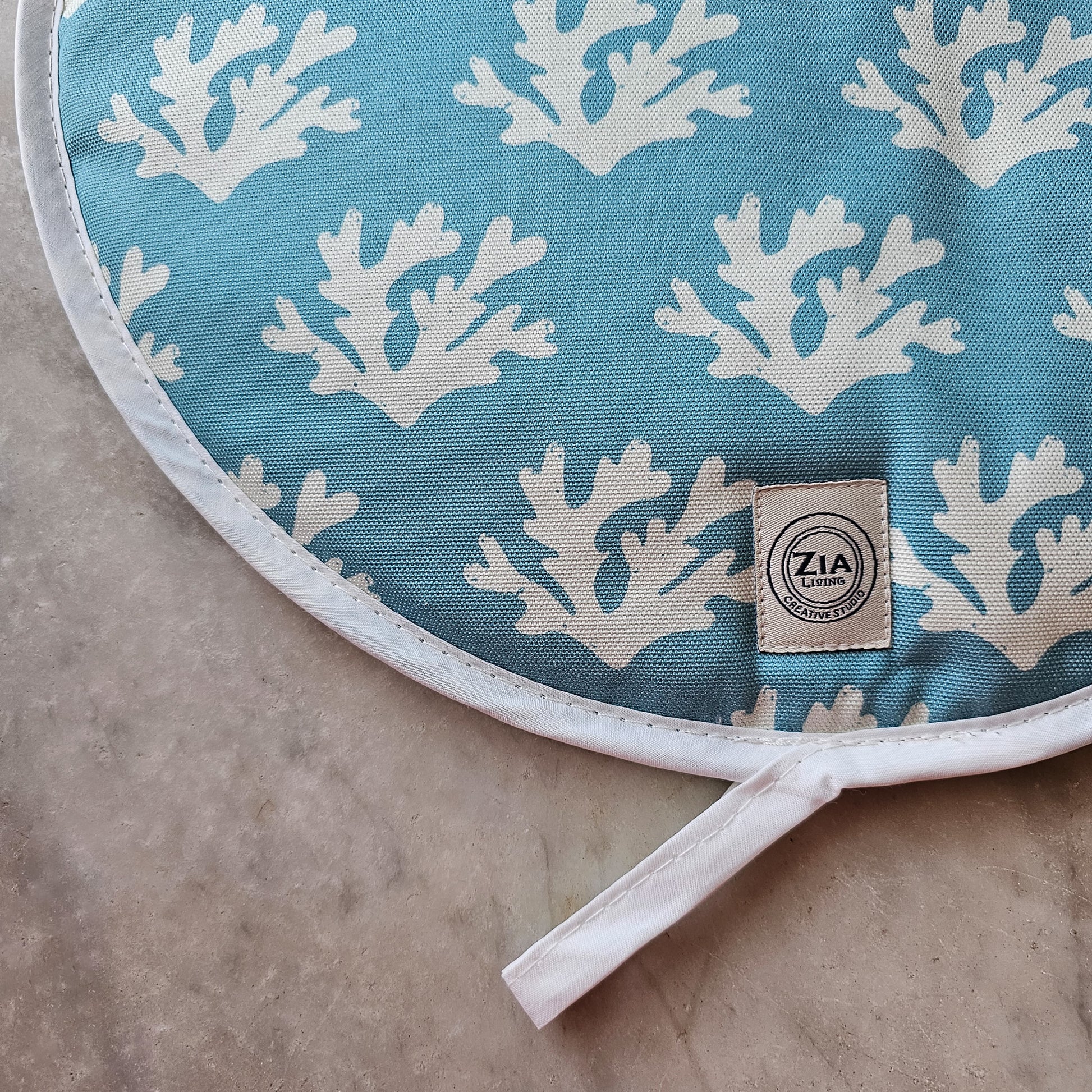 Blue seaweed print Aga and hob covers by ZIA LIVING, featuring a white coral motif on a deep‑blue cotton base, shown as close up 