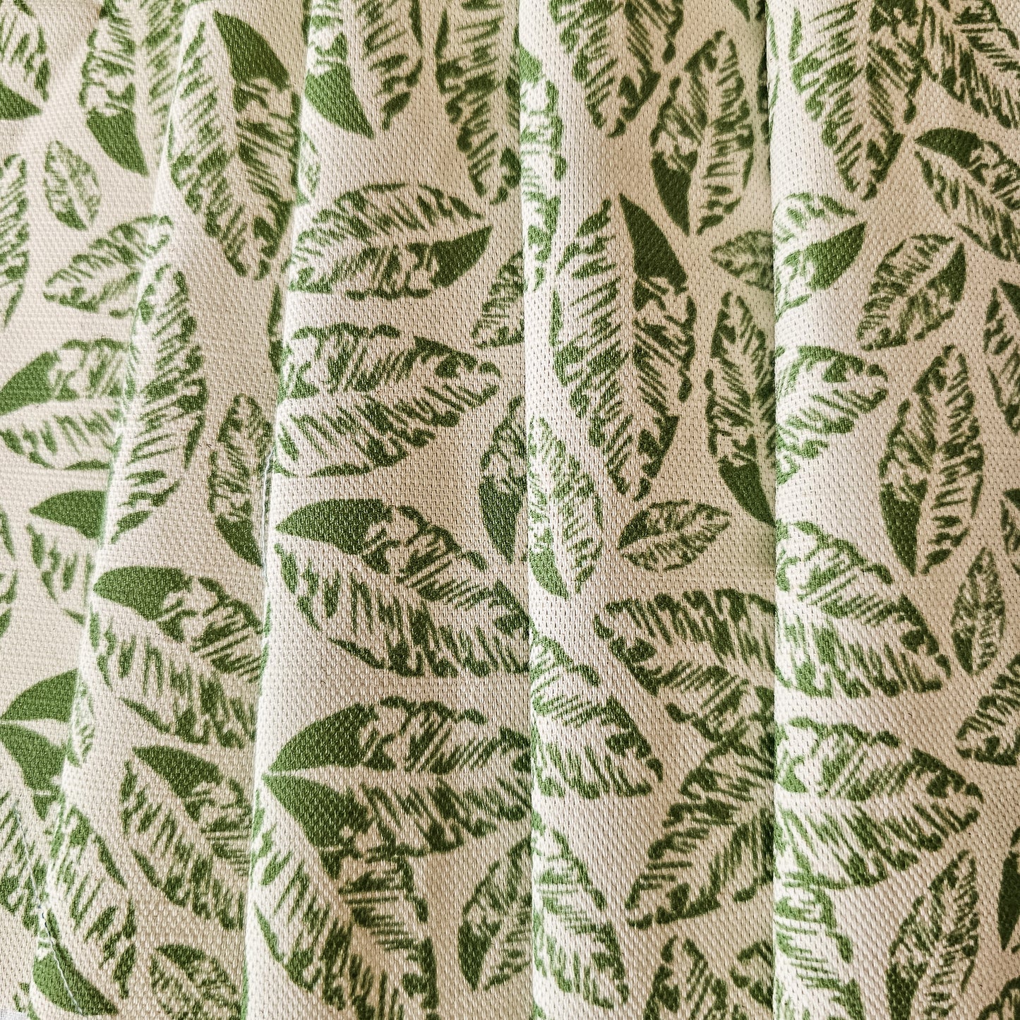 Zia Living, leaf print fabric is green featured on draped fabric