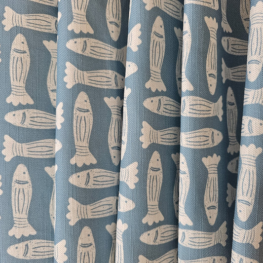 Zia Living, Fishes print fabric in blue, featured as fabric drapes.