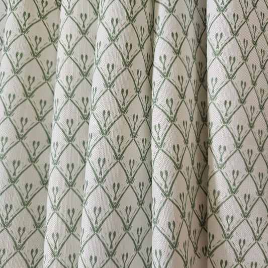 Rosemary Classic cotton‑linen fabric with a white background and green coloured repeat featured as curtains— ZIA LIVING.