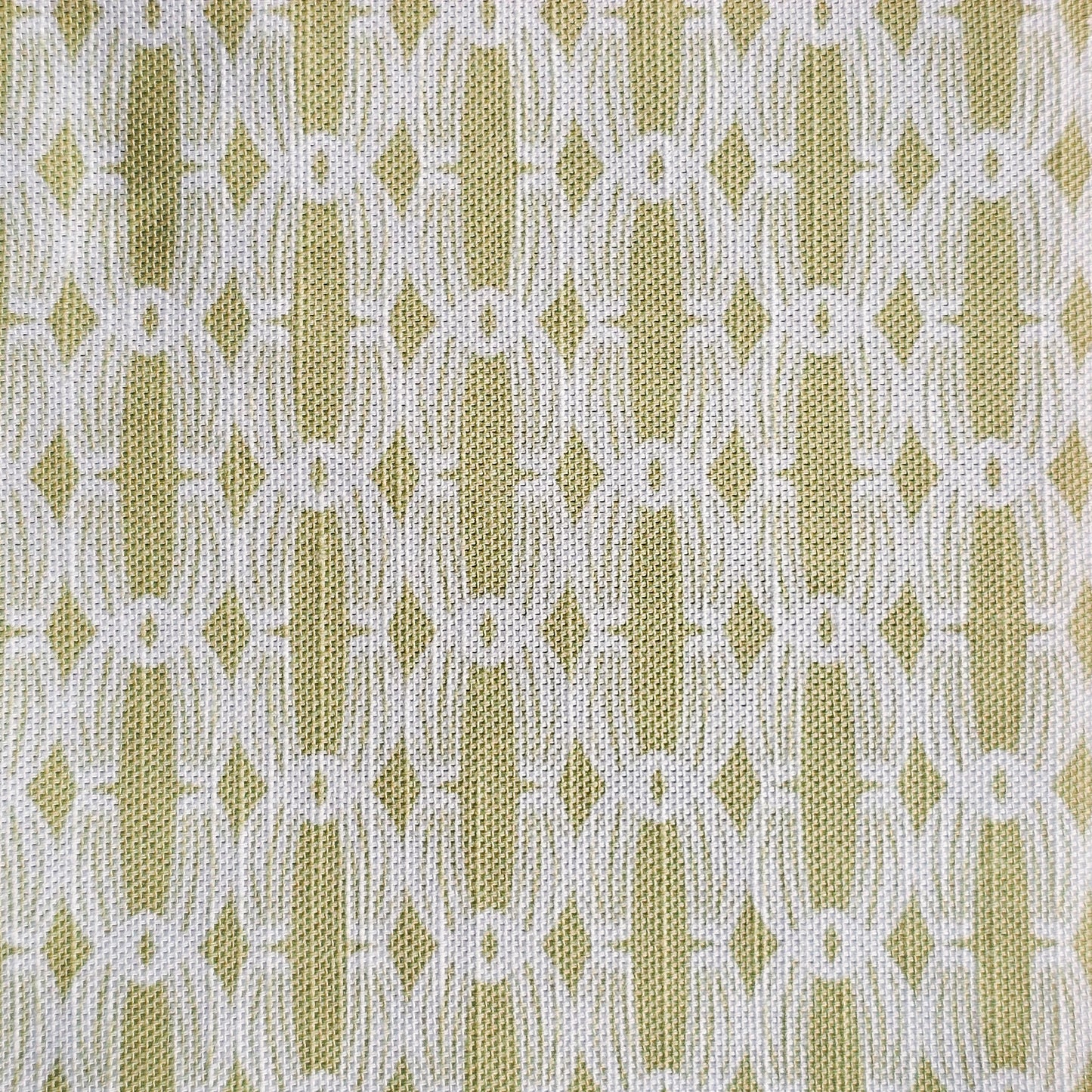 Close‑up of ZIA LIVING’s Anello cotton‑linen fabric in yorkstone and white, showing its interlocking oval and diamond geometric weave pattern and textured artisan finish.