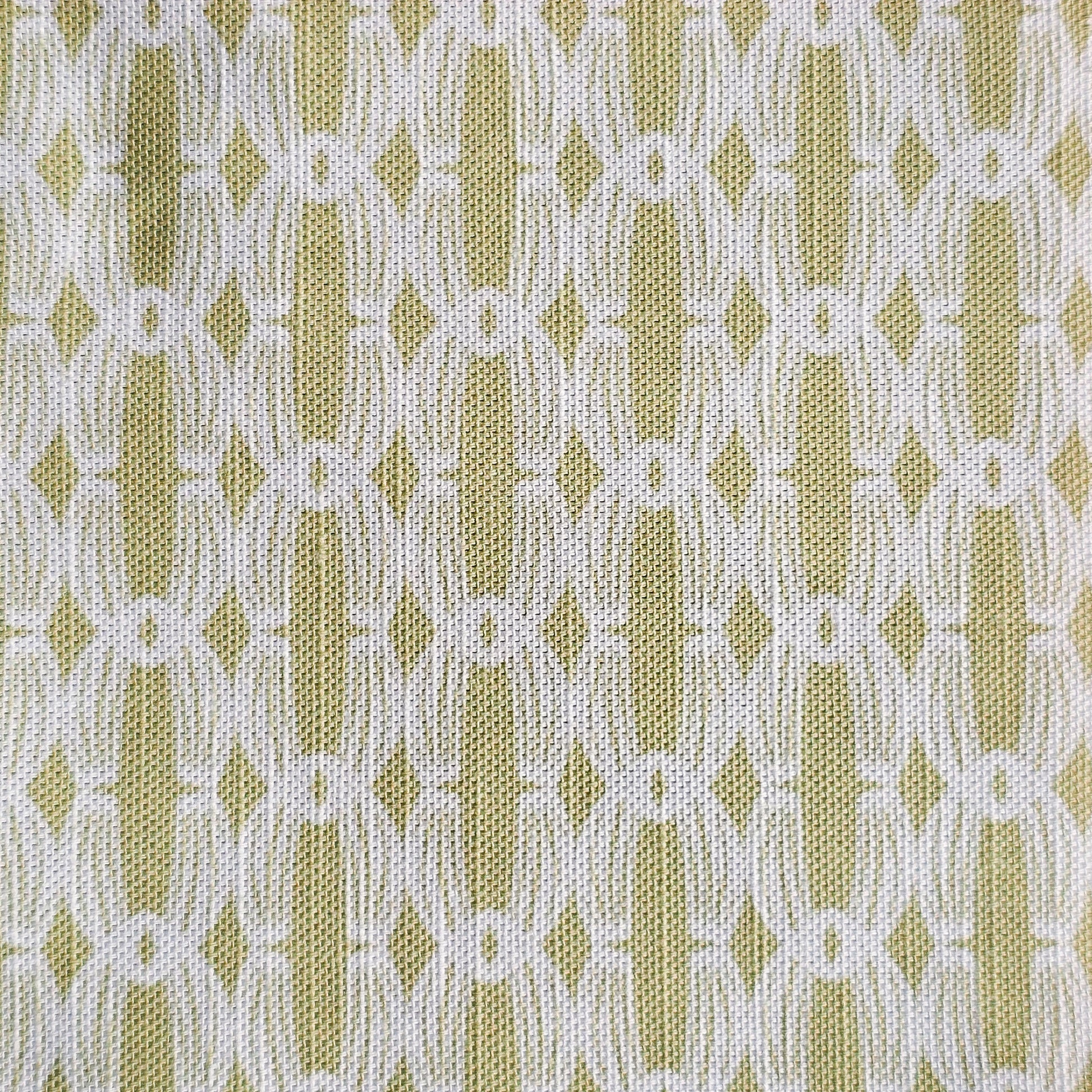 Close‑up of ZIA LIVING’s Anello cotton‑linen fabric in yorkstone and white, showing its interlocking oval and diamond geometric weave pattern and textured artisan finish.