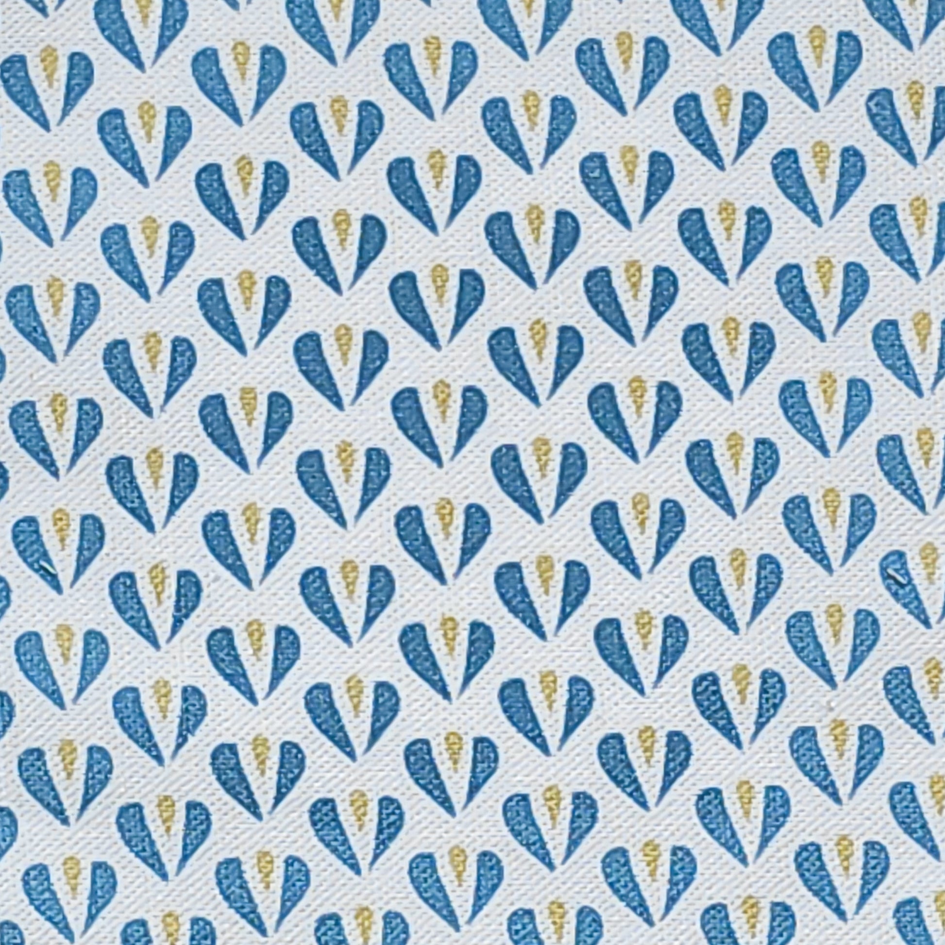 Carina, heart shaped motif in blue and sand colours on neutral fabric, shown as fabric swatch, by Zia Living