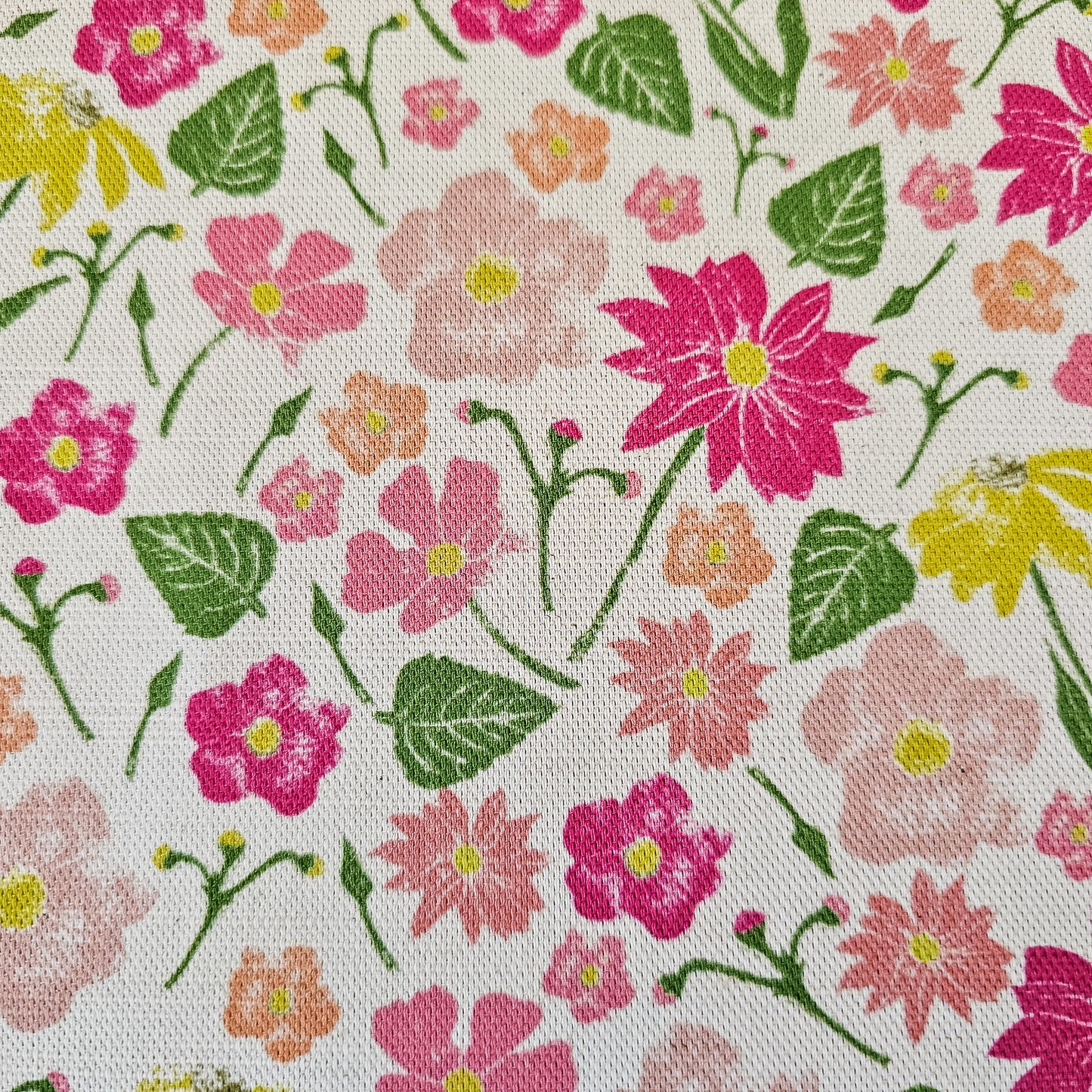 Flower garden a floral pattern cotton‑linen fabric by ZIA LIVING, featuring a floral and leaf motifs in pinks, yellows on a white background.