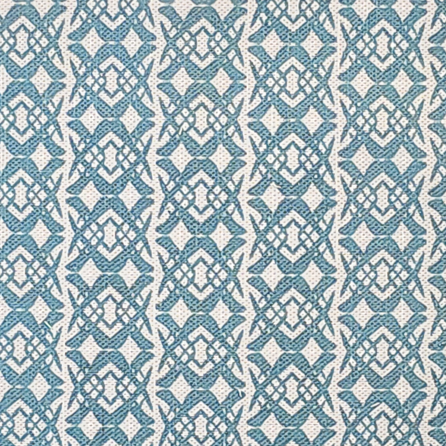 Fornet Classic cotton linen fabric swatch featuring a repeating blue interlocking curved motif on an off‑white background. ZIA LIVING