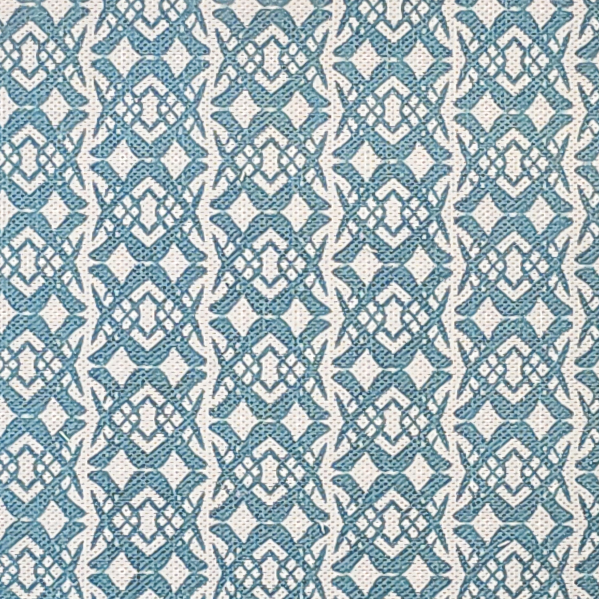 Fornet Classic cotton linen fabric swatch featuring a repeating blue interlocking curved motif on an off‑white background. ZIA LIVING