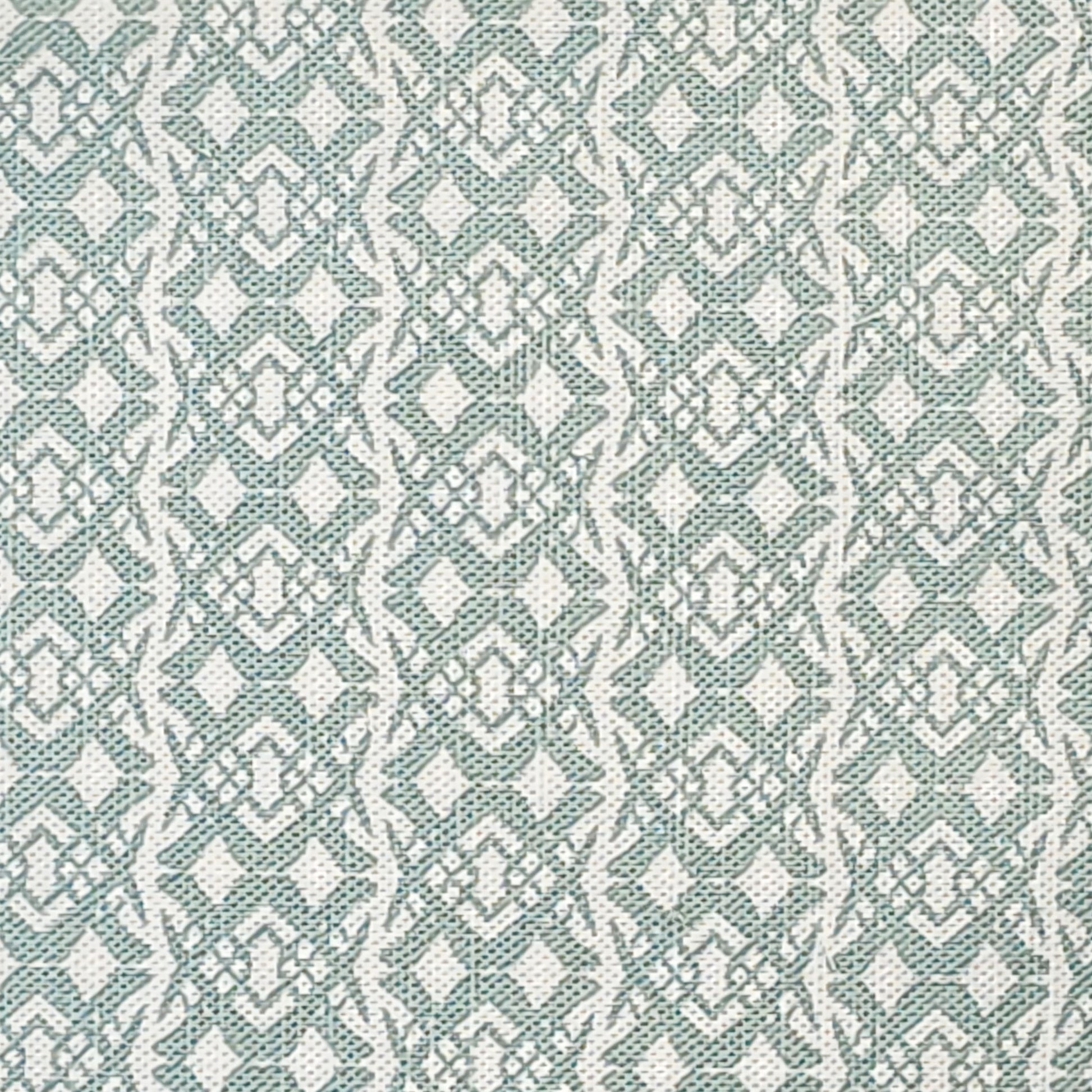 Fornet Classic cotton linen fabric swatch featuring a repeating pale blue interlocking curved motif on an off‑white background. ZIA LIVING