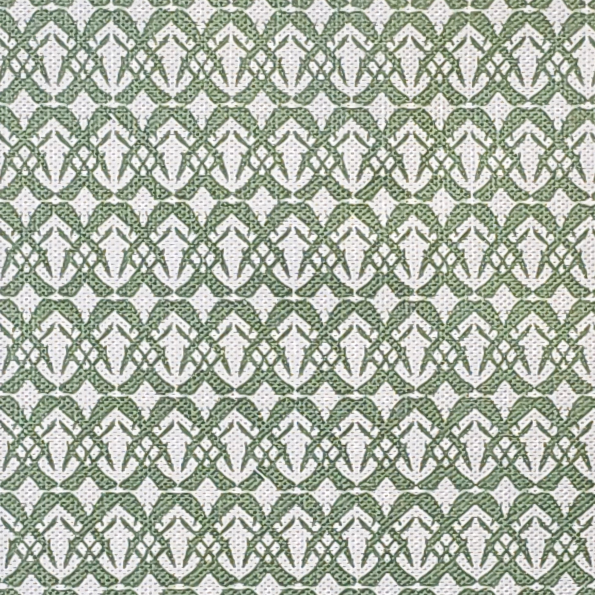 Fornet cotton linen fabric featuring a repeating green interlocking geometric motif on an off‑white background. ZIA LIVING.