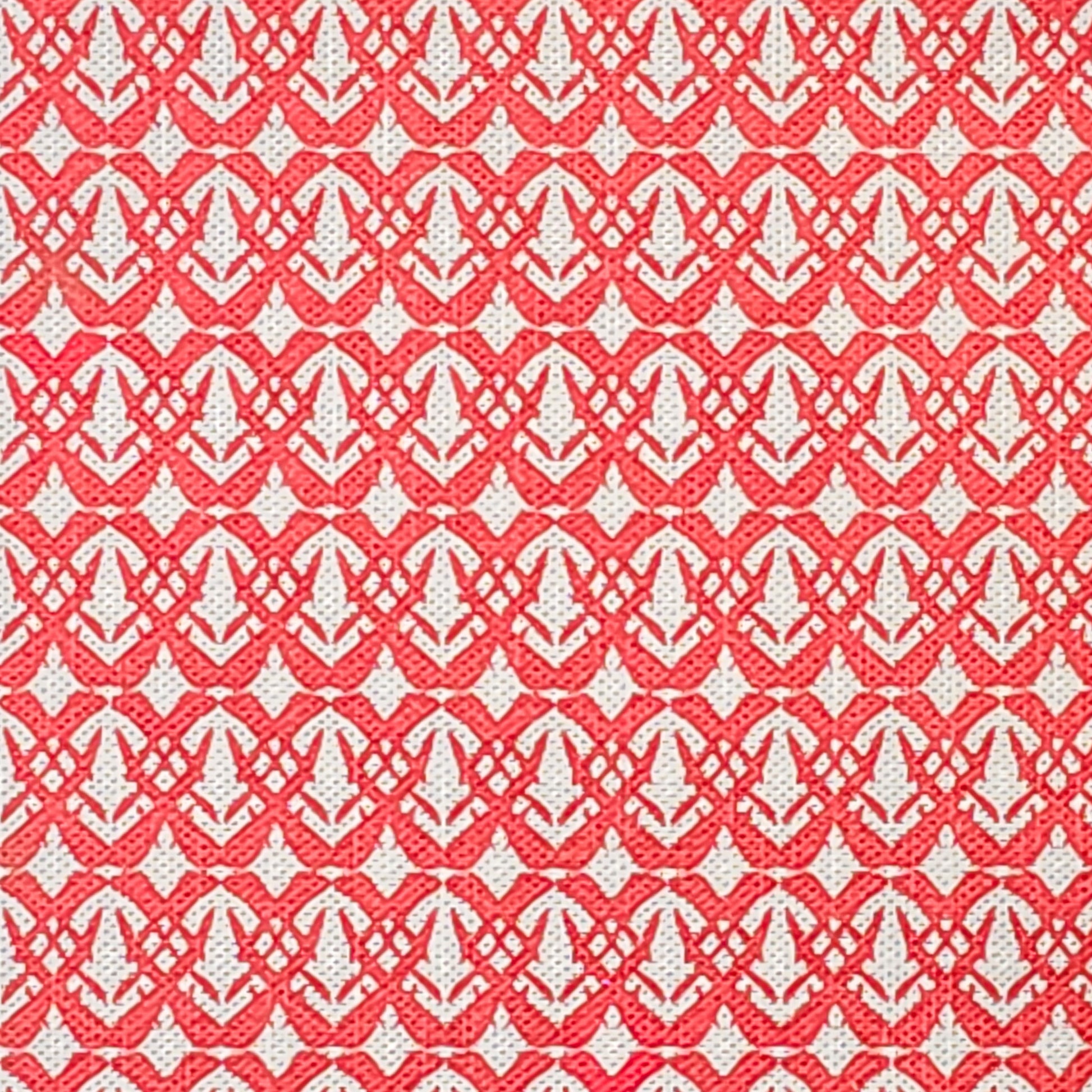 Fornet cotton linen fabric featuring a repeating raspberry  interlocking geometric motif on an off‑white background. ZIA LIVING.