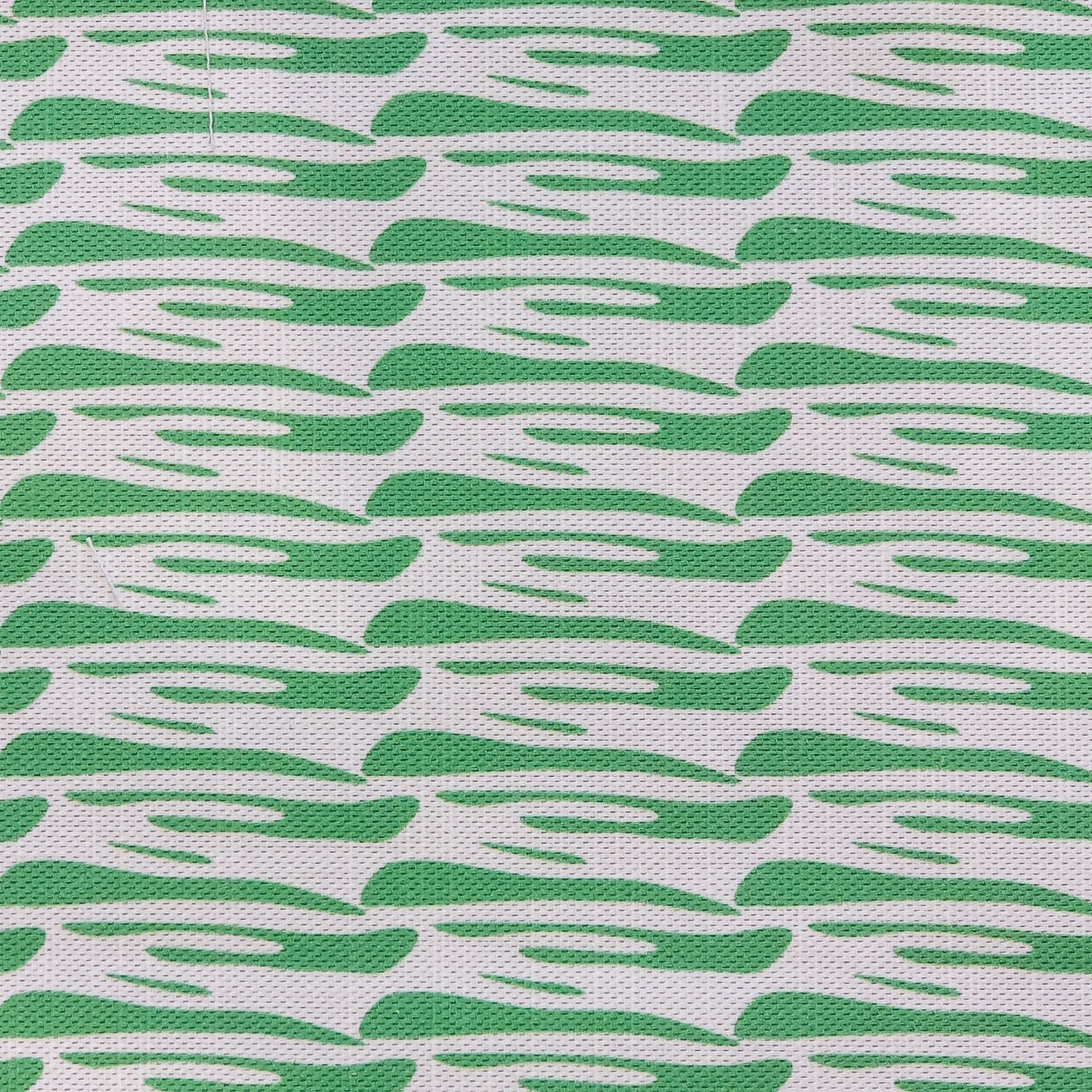 Ondina green wave‑pattern cotton‑linen fabric by ZIA LIVING, featuring a repeating lino‑style motif on a white background.