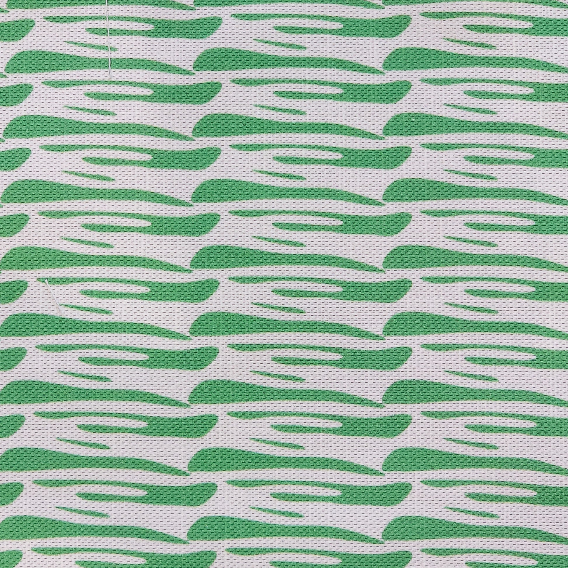 Ondina green wave‑pattern cotton‑linen fabric by ZIA LIVING, featuring a repeating lino‑style motif on a white background.