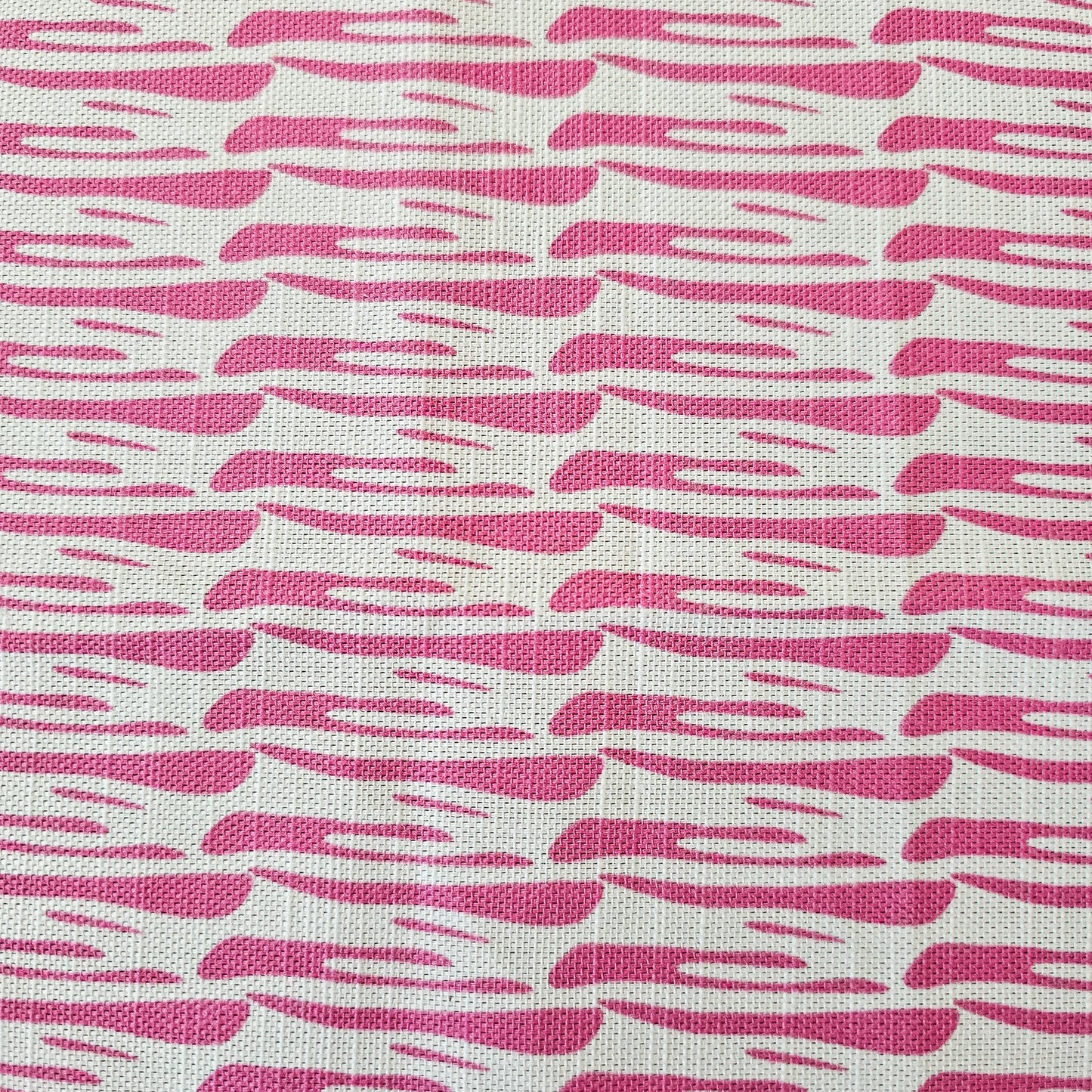 Ondina pink wave‑pattern cotton‑linen fabric by ZIA LIVING, featuring a repeating lino‑style motif on a white background.