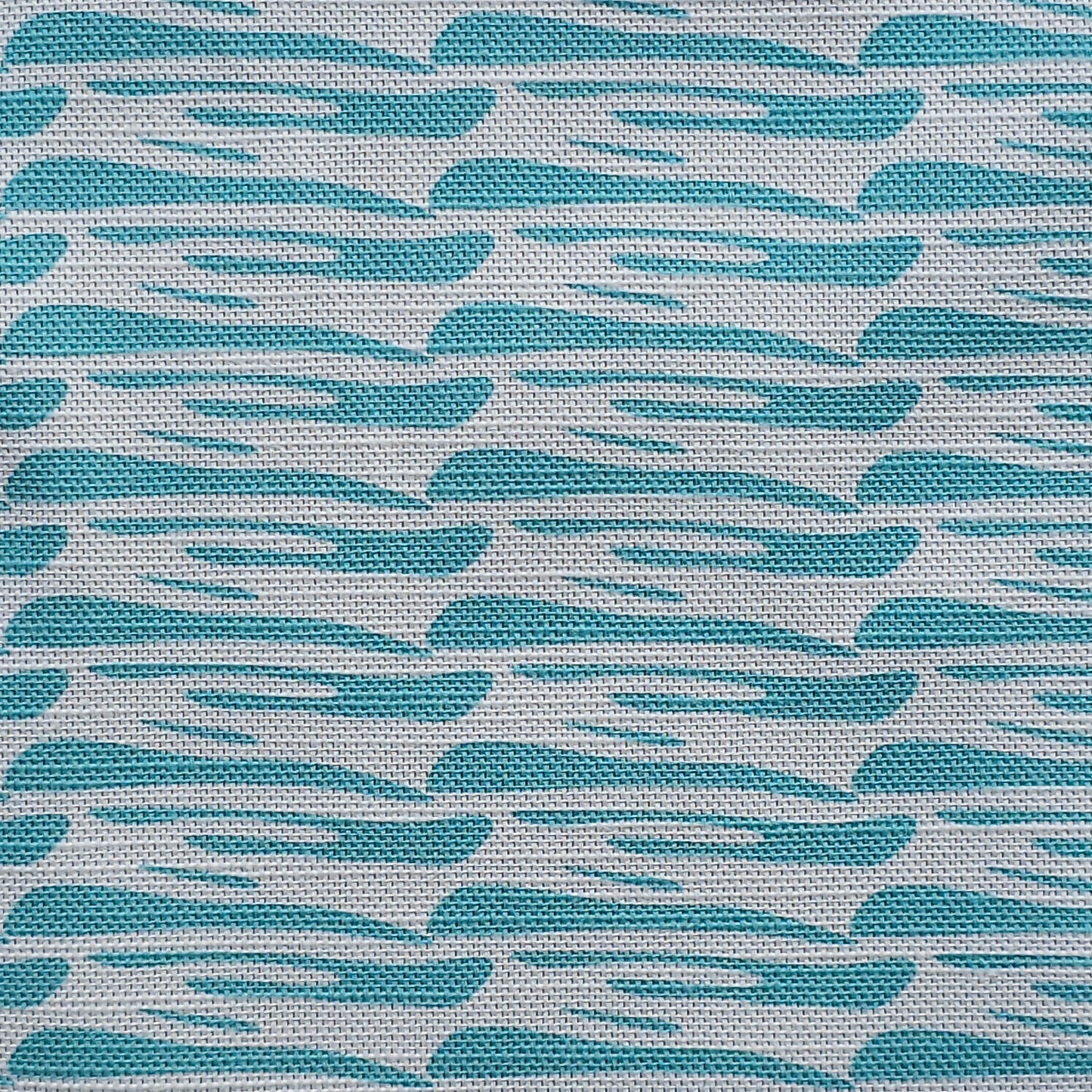 Ondina blue wave‑pattern cotton‑linen fabric by ZIA LIVING, featuring a repeating lino‑style motif on a white background.