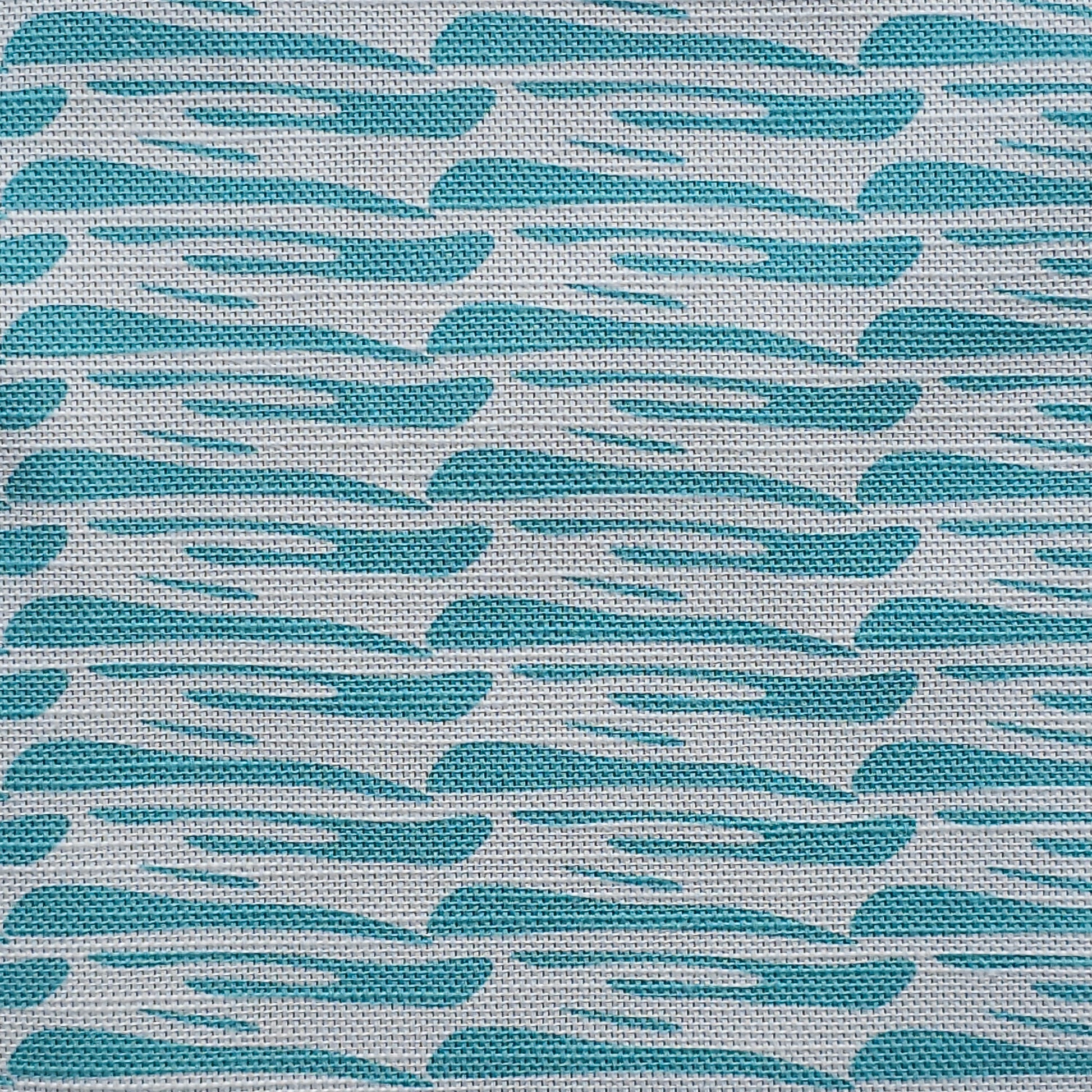 Ondina blue wave‑pattern cotton‑linen fabric by ZIA LIVING, featuring a repeating lino‑style motif on a white background.
