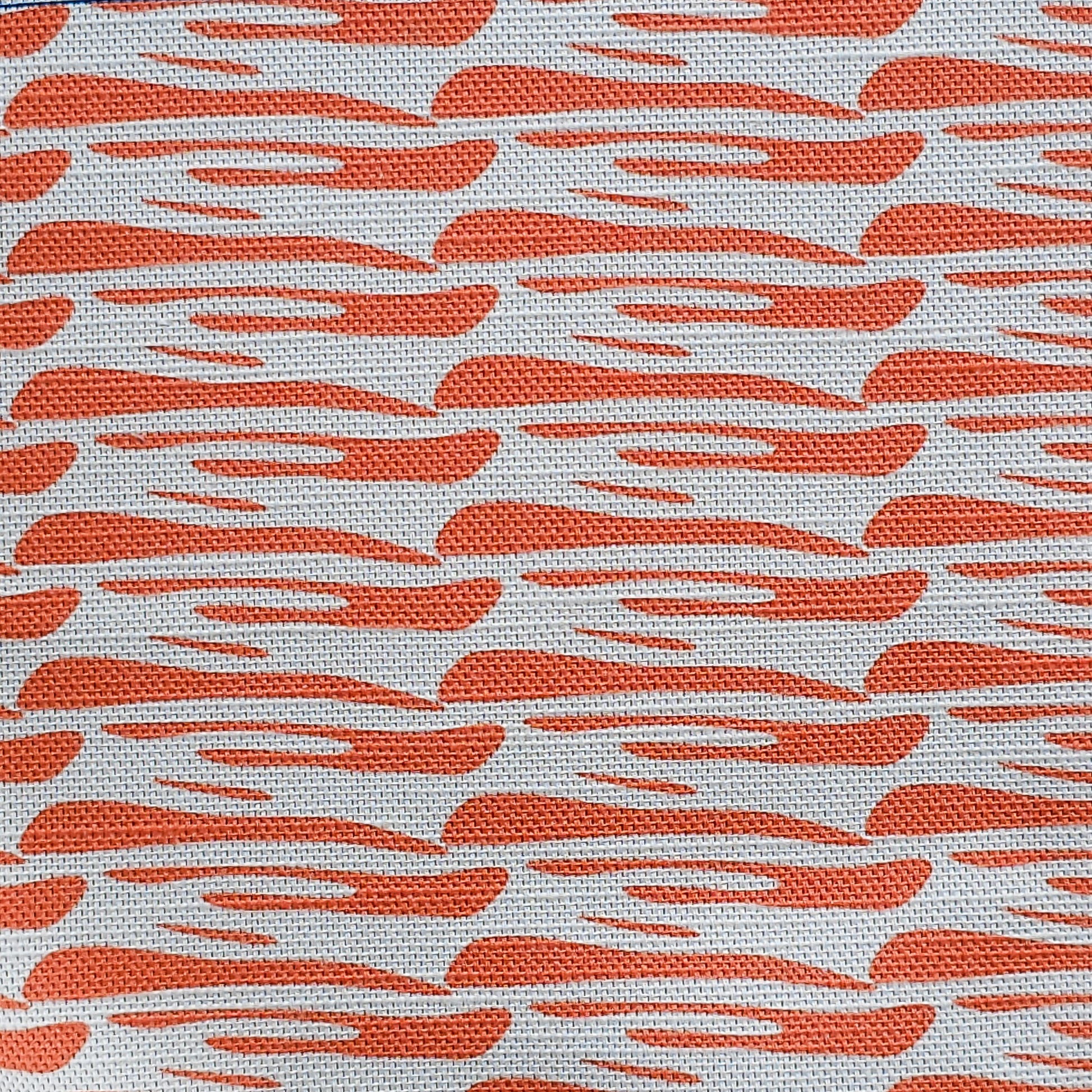 Ondina orange wave‑pattern cotton‑linen fabric by ZIA LIVING, featuring a repeating lino‑style motif on a white background.