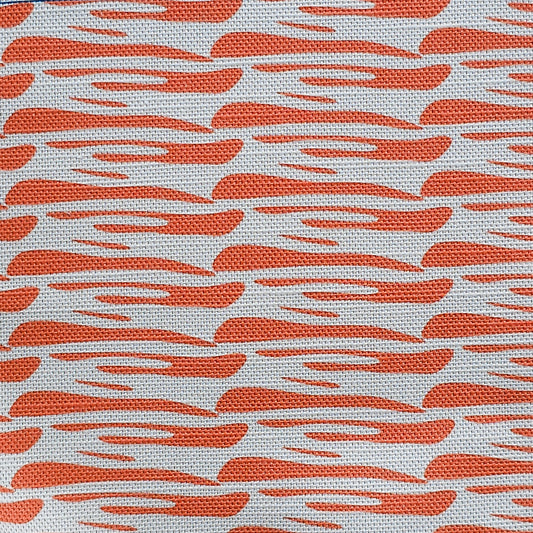 Ondina orange wave‑pattern cotton‑linen fabric by ZIA LIVING, featuring a repeating lino‑style motif on a white background.