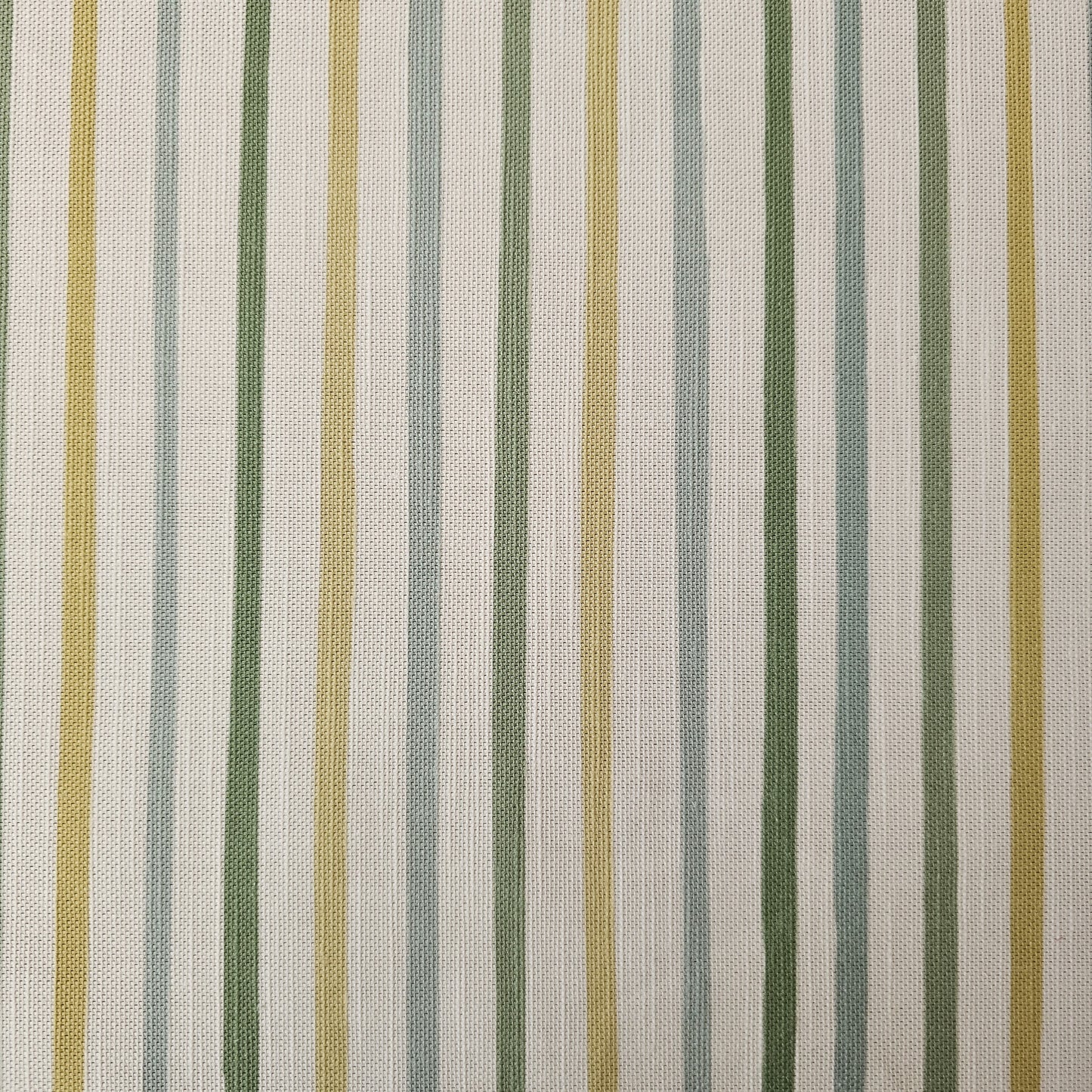 Zia Living fabric swatch in neutral green, yellow, strips