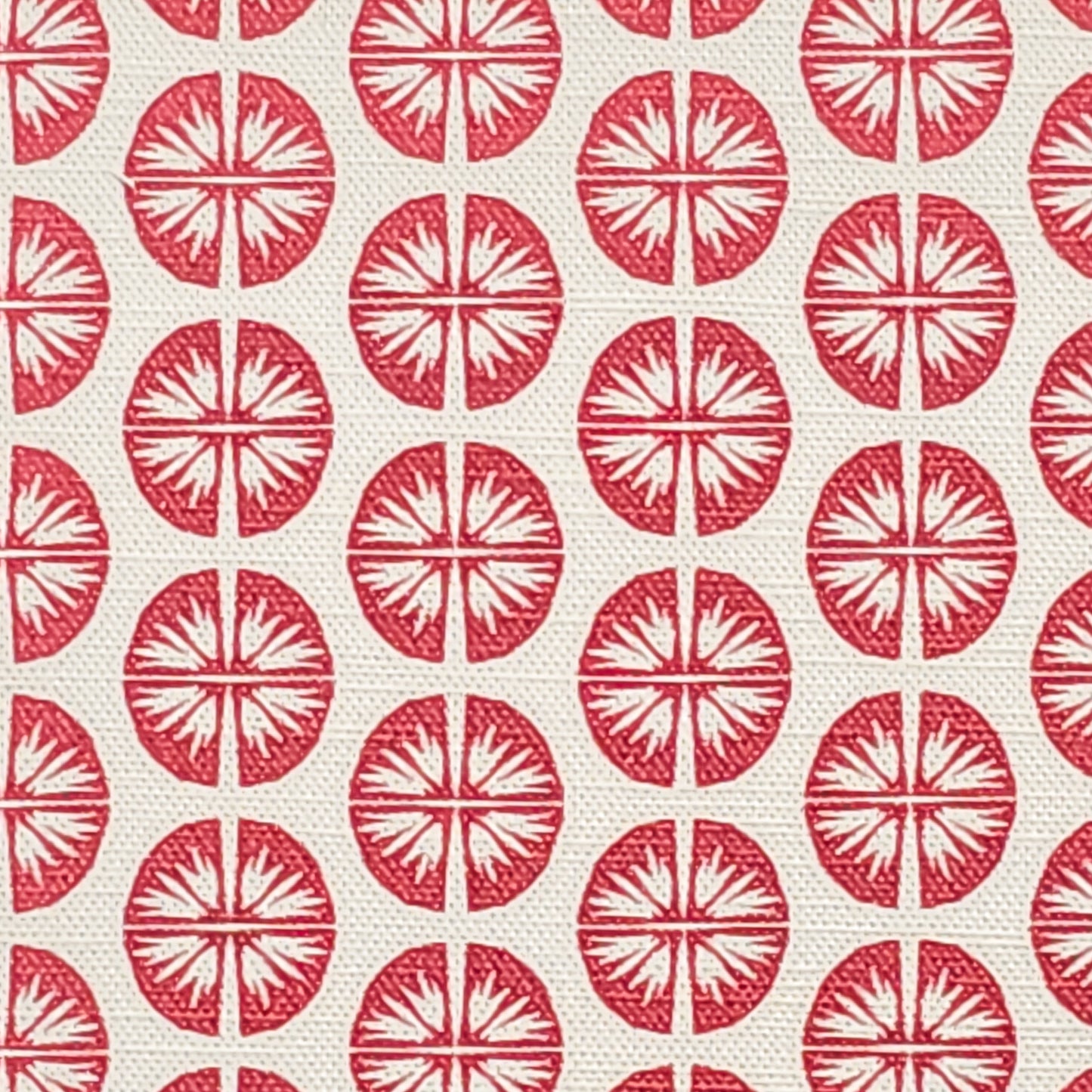 Pressed Flower cotton linen fabric featuring bold red circular floral motifs in a repeating pattern on an off‑white background. ZIA LIVING