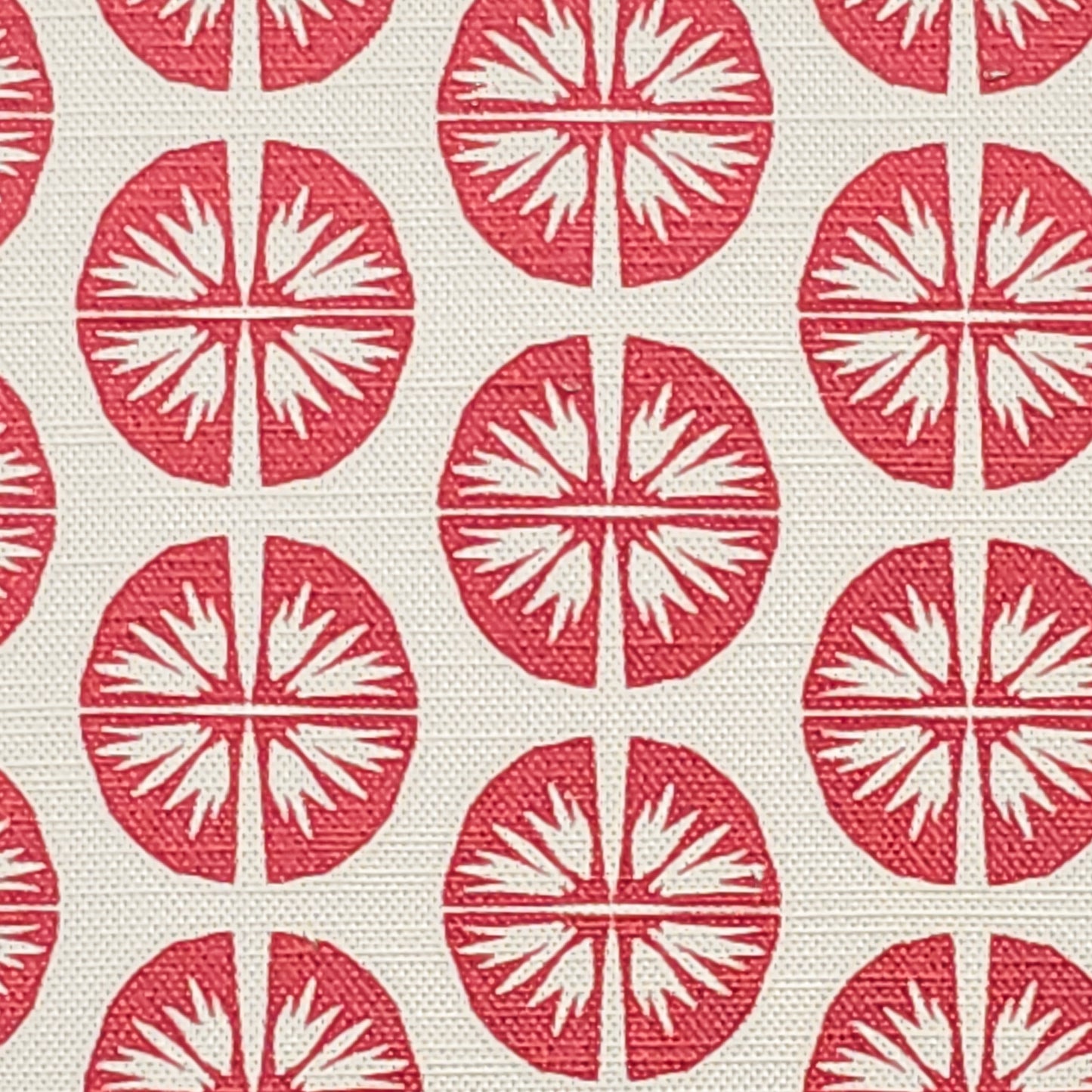 Pressed Flower cotton linen fabric featuring bold red circular floral motifs in a repeating pattern on an off‑white background. ZIA LIVING