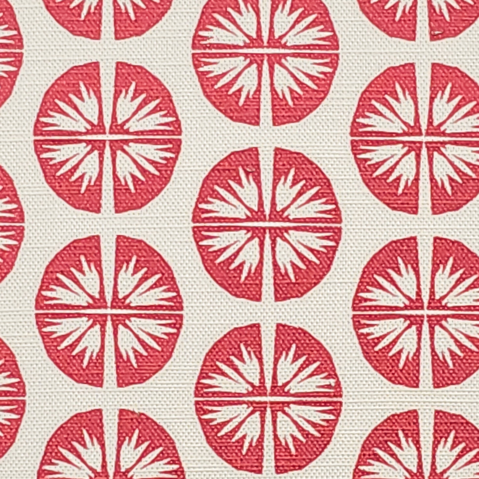 Pressed Flower cotton linen fabric featuring bold red circular floral motifs in a repeating pattern on an off‑white background. ZIA LIVING