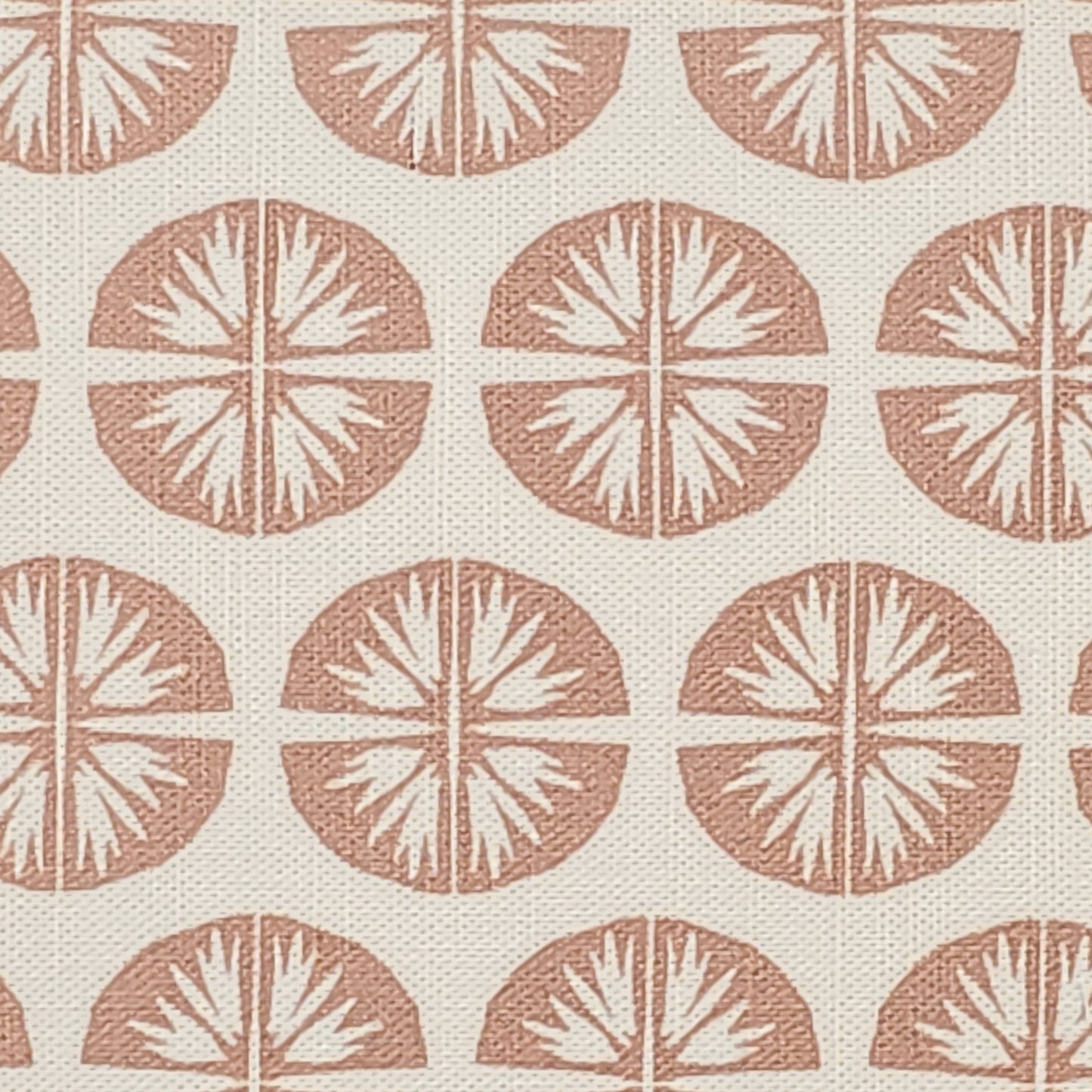 Pressed Flower cotton linen fabric featuring muted pink circular floral motifs in a repeating pattern on an off‑white background. ZIA LIVING