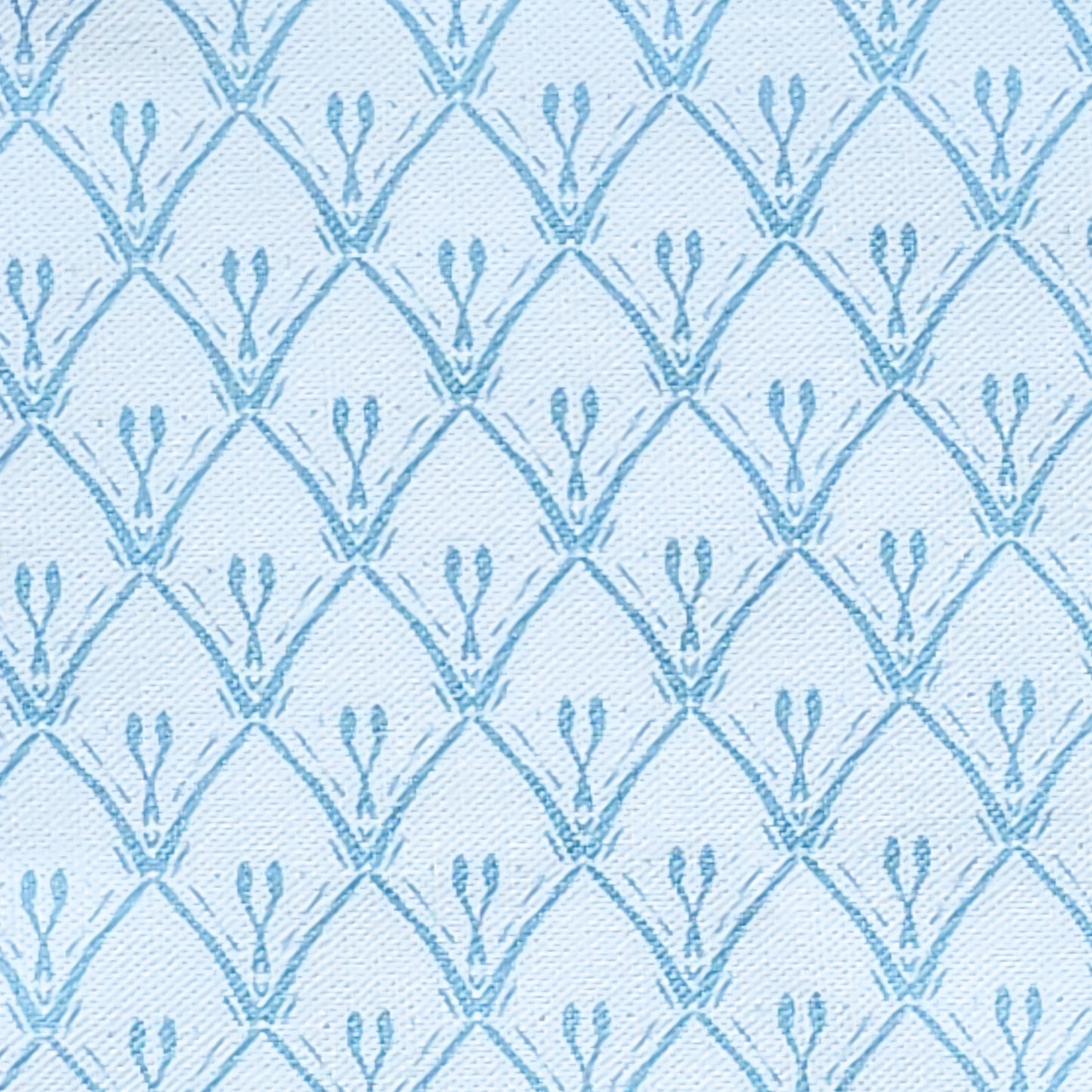 Blue trellis‑style lino print on cotton‑linen fabric with a white
textured background — ZIA LIVING.