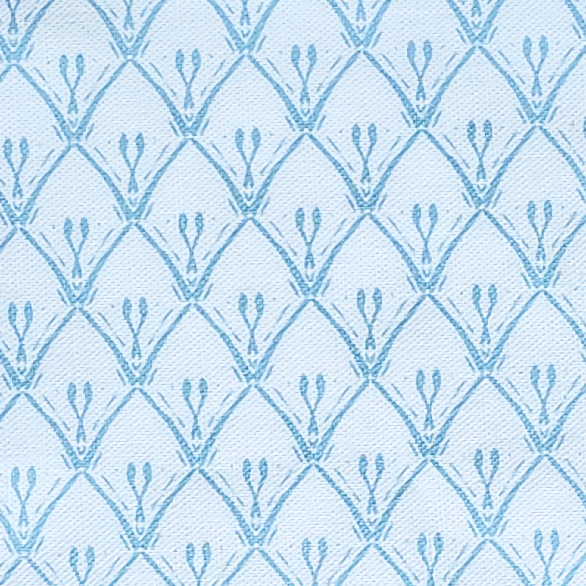 Blue trellis‑style lino print on cotton‑linen fabric with a white
textured background — ZIA LIVING.