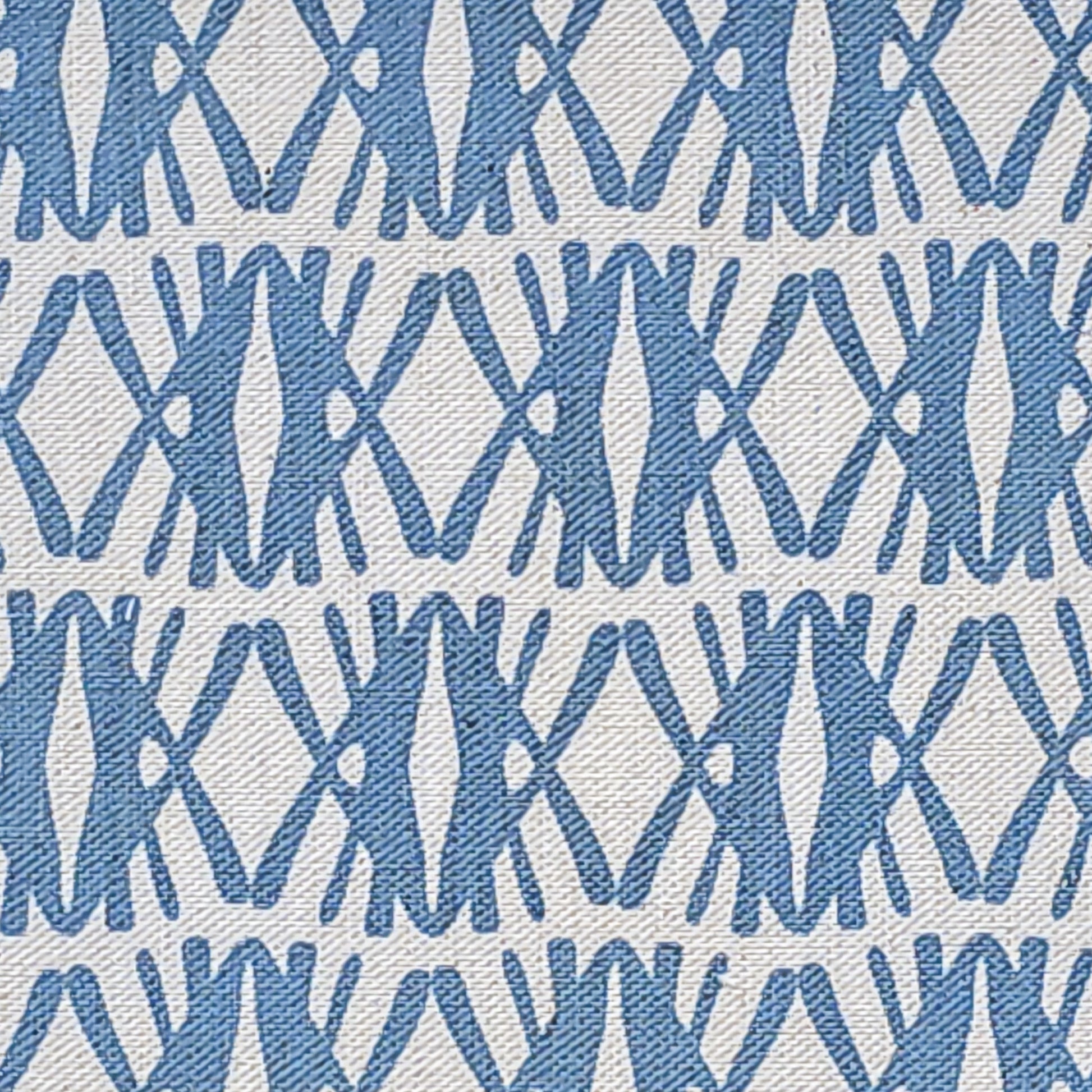 Seagrass cotton linen fabric featuring interlocking  blue woven‑style motifs in a repeating geometric pattern on a natural background. ZIA LIVING.