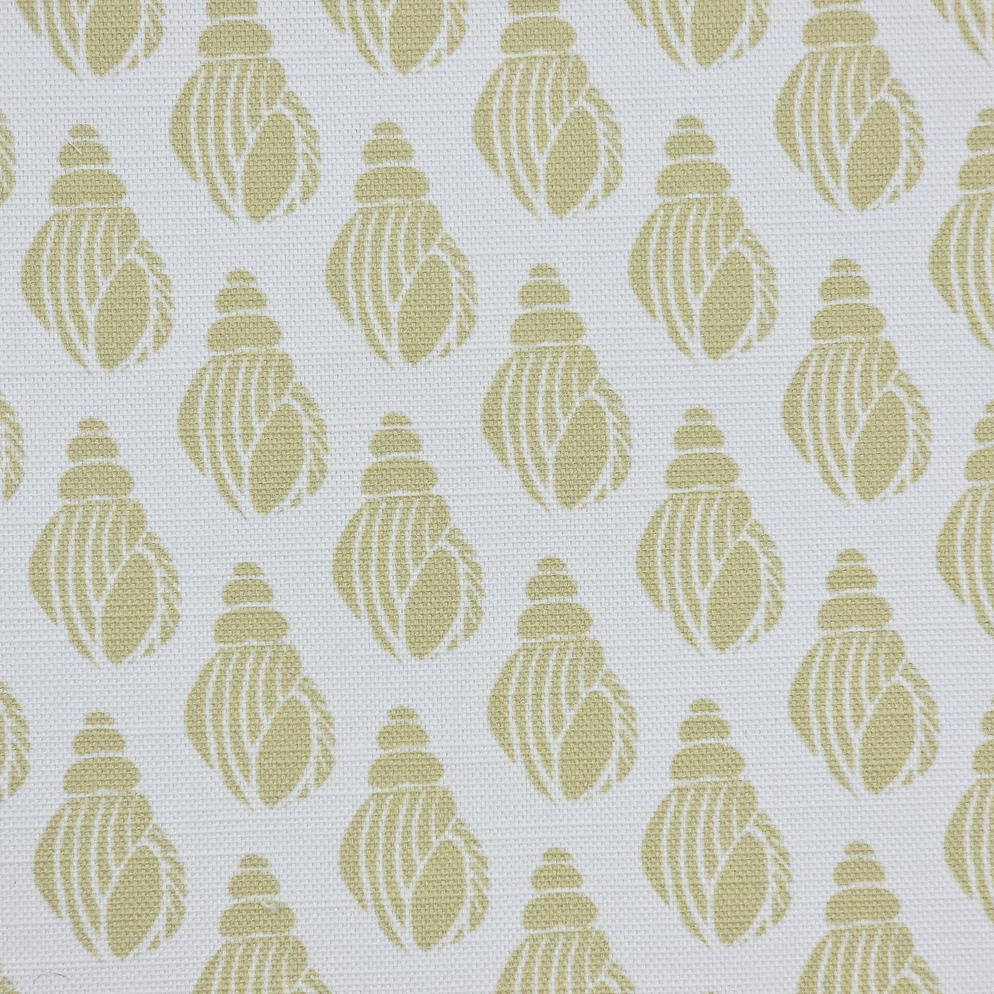 Shell lino print design cotton linen fabric featuring shell motifs in soft sand colour on an off‑white background. ZIA LIVING