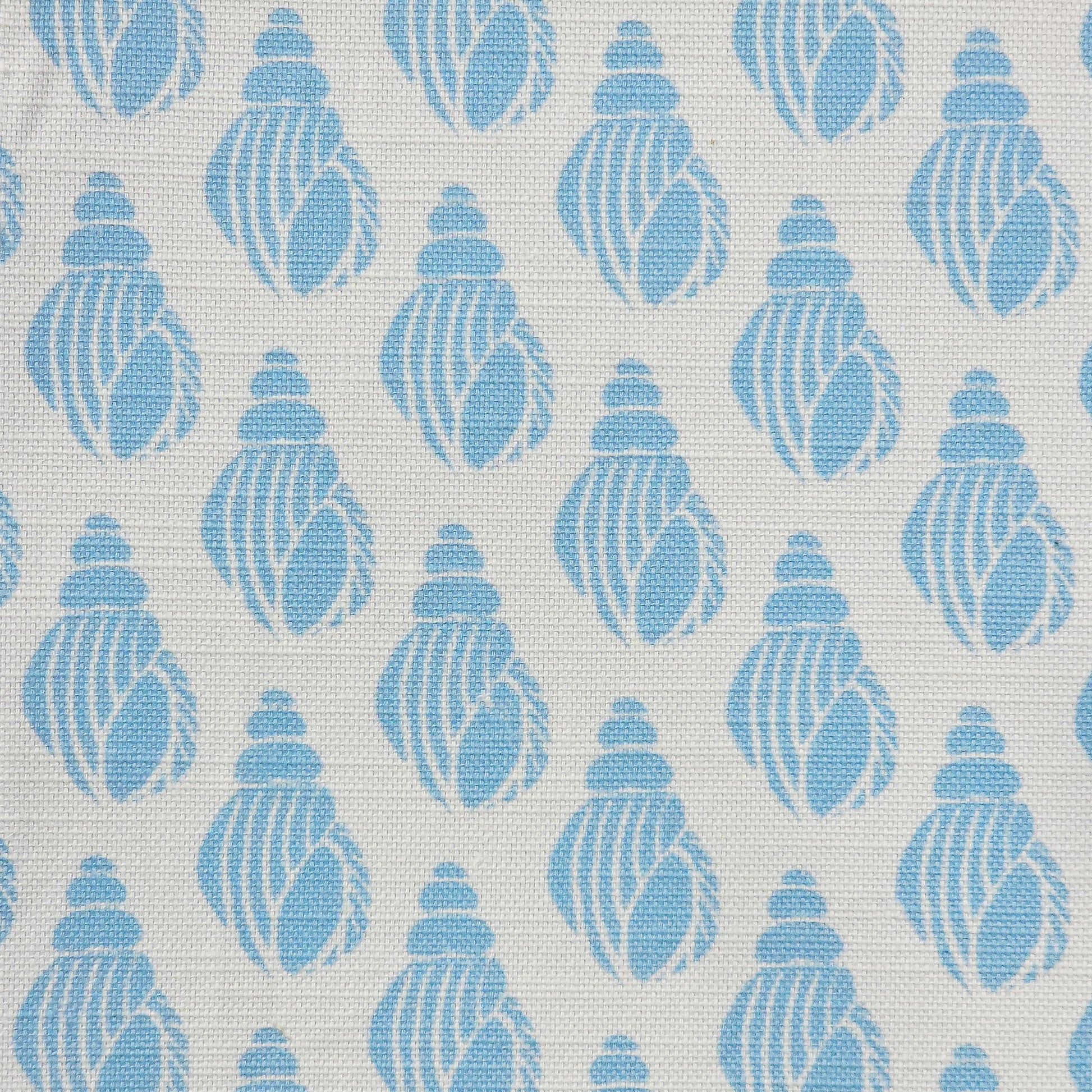 Shell lino print design cotton linen fabric featuring shell motifs in soft sky blue on an off‑white background. ZIA LIVING