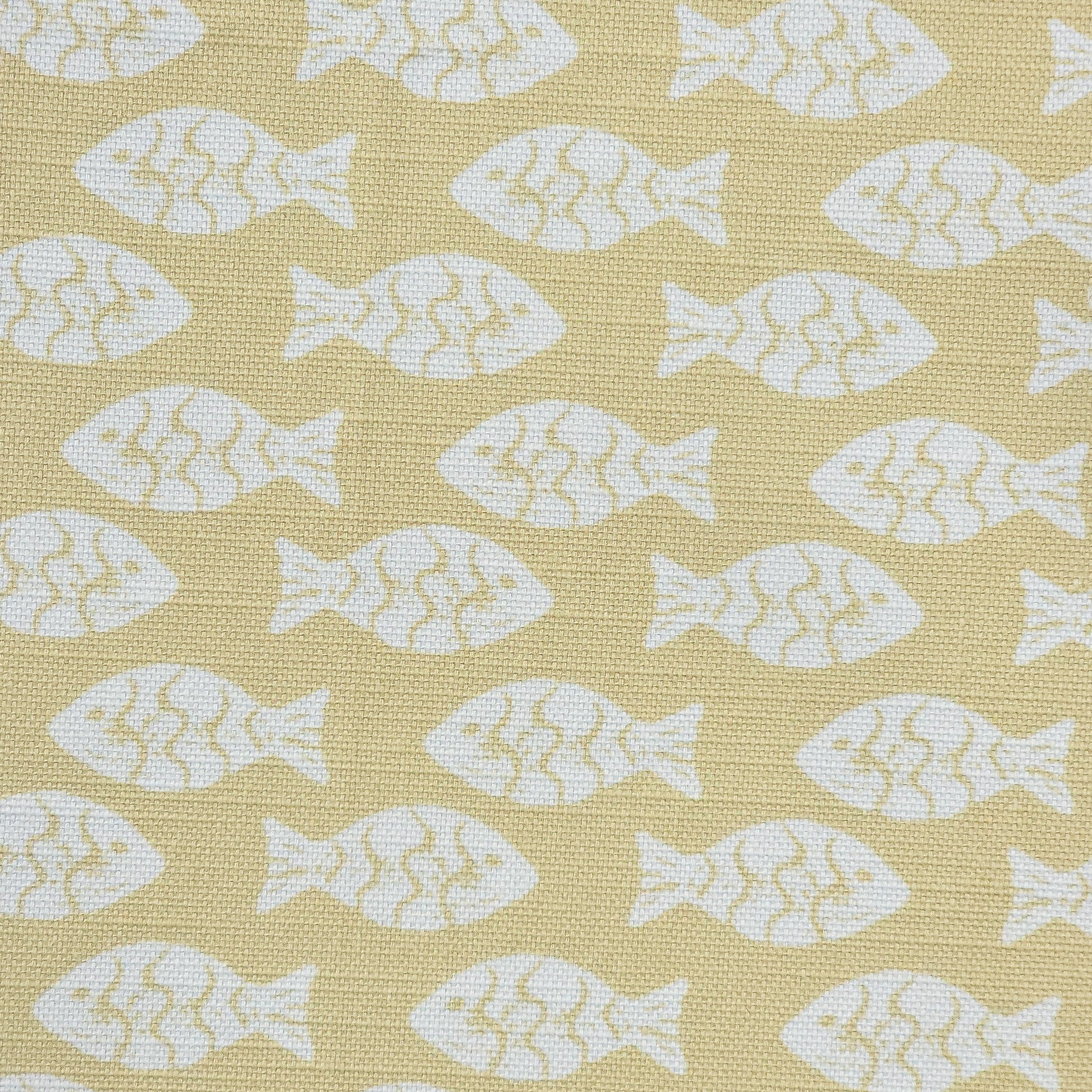 Shoal block‑print cotton linen fabric in off white featuring alternating stylised small fish motifs on an sand coloured background. ZIA LIVING.