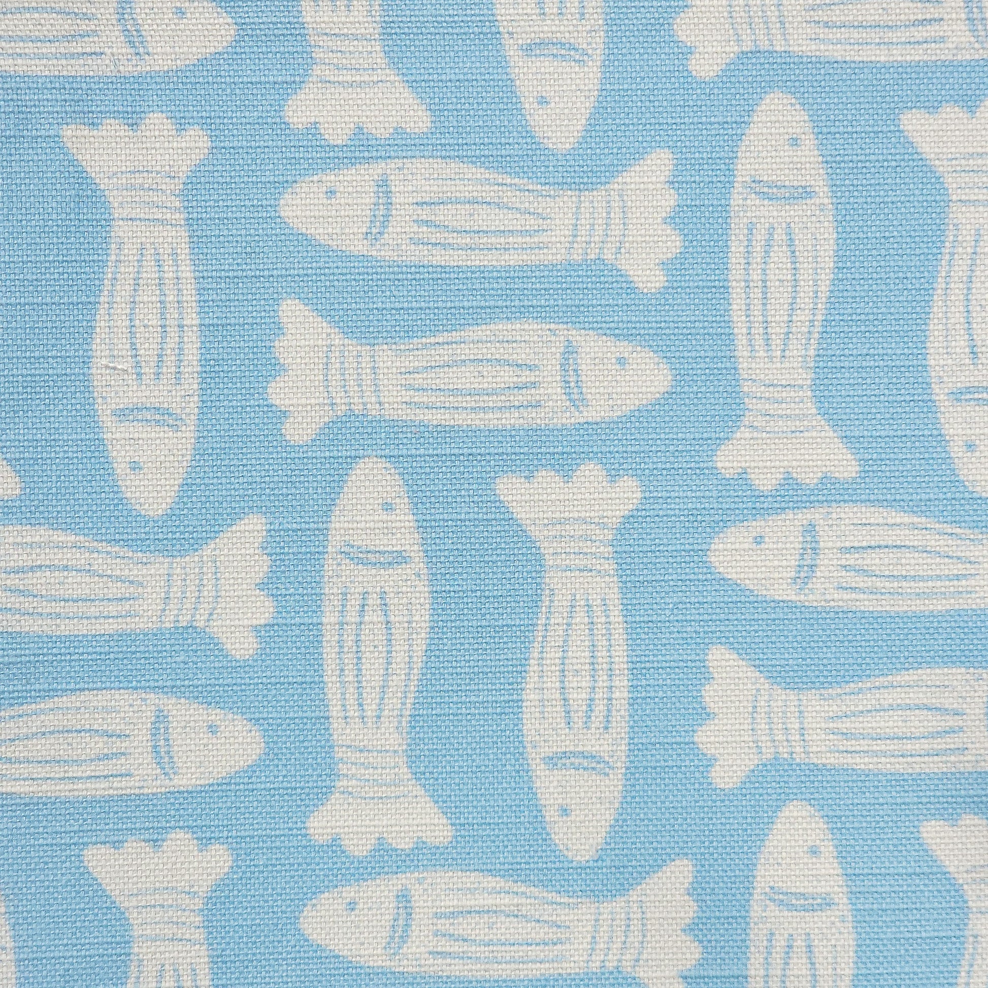 Fishes block‑print cotton linen fabric in off white featuring alternating stylised fish motifs on an sky blue background. ZIA LIVING.