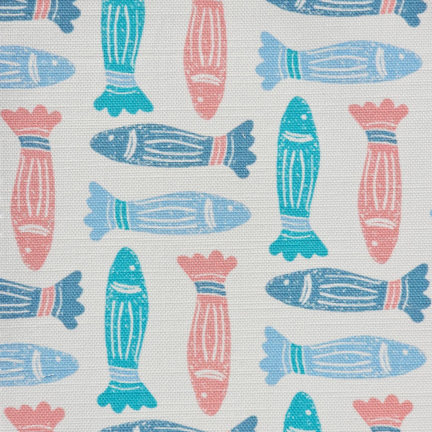 Fishes lino print cotton linen fabric in blue, teal and coral, featuring alternating stylised fish motifs on an off‑white background. ZIA LIVING.