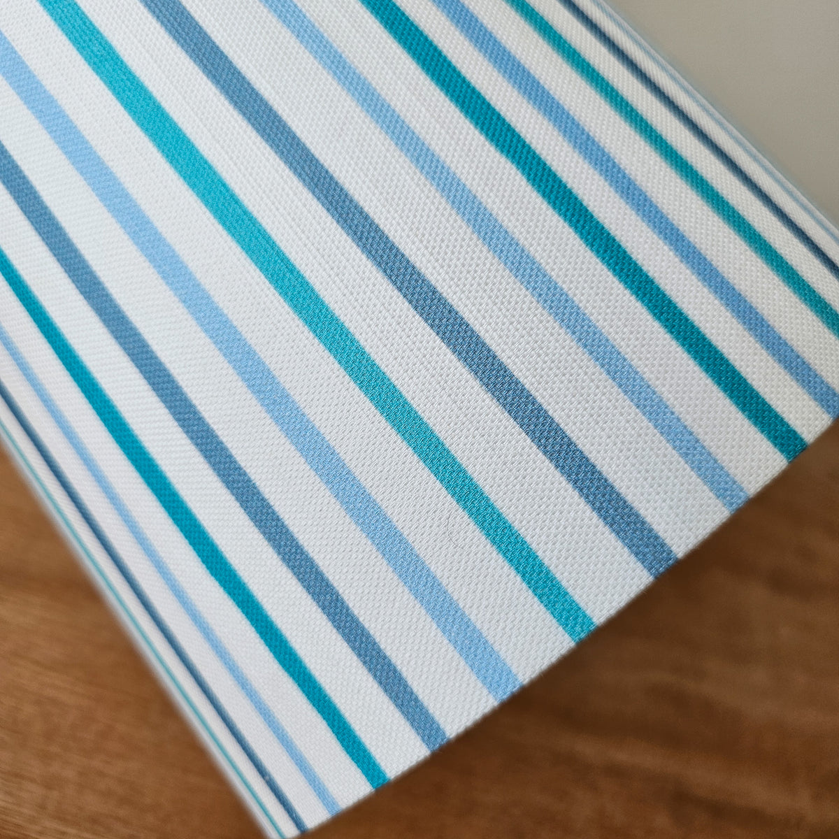 blue and white stripped lampshade close up