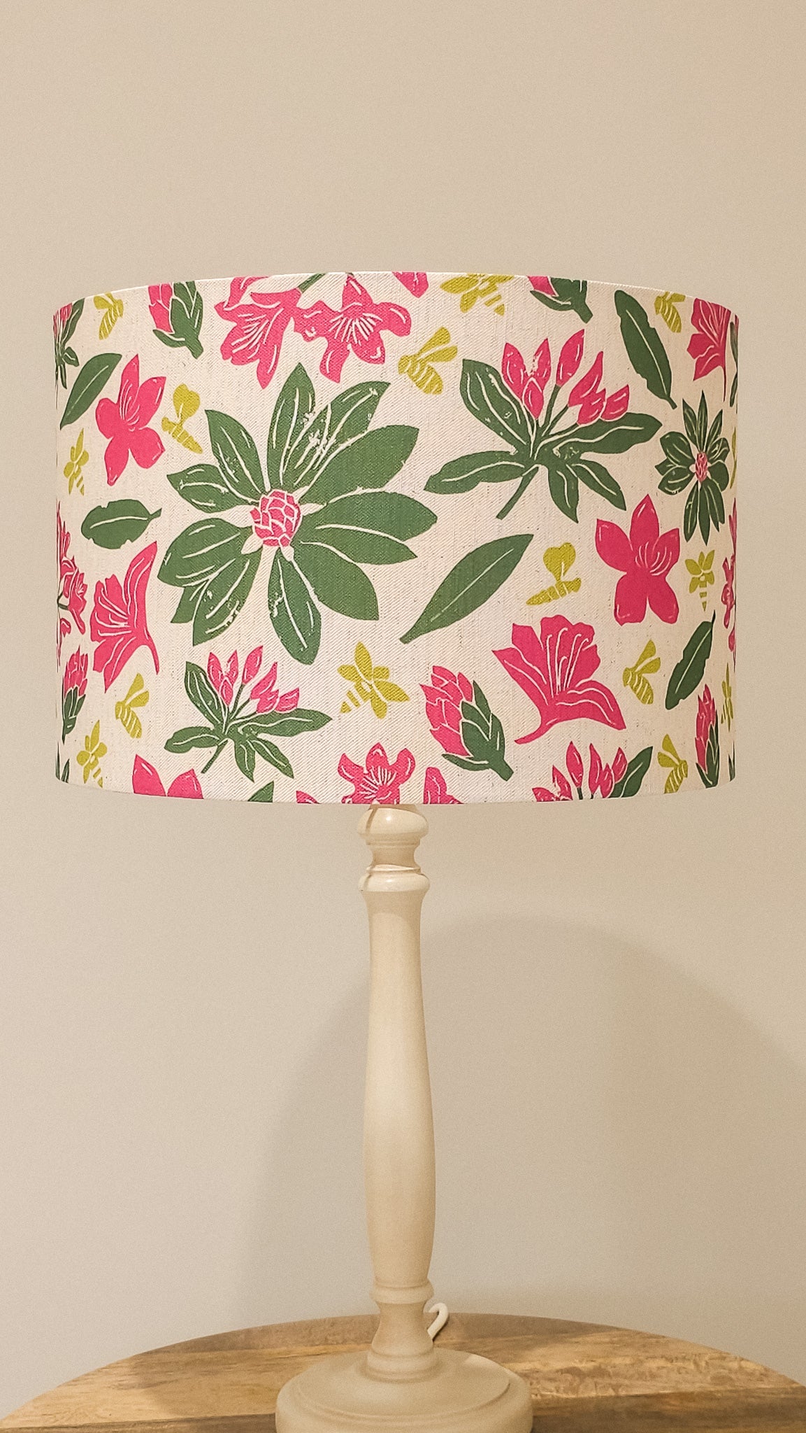 Floral rhododendron fabric pattern with pink and green flowers on a beige background, featured as lampshade - Zia Living 
