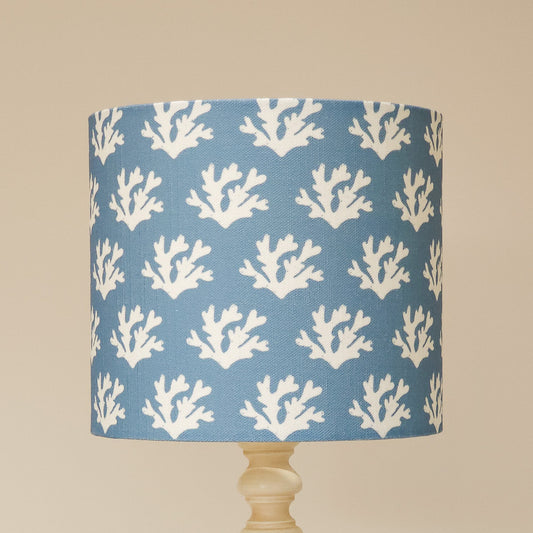 Zia Living Seaweed drum lampshade with white seaweed coral pattern on a blue background. 