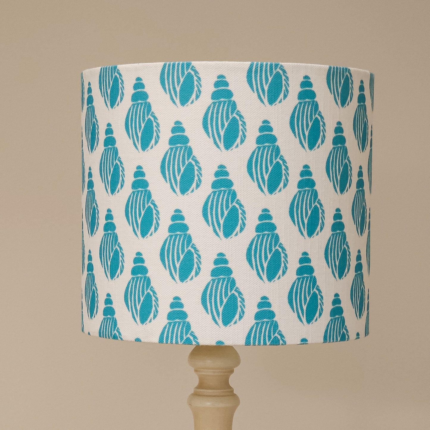 Lampshade with teal shell pattern on white background by Zia Living
