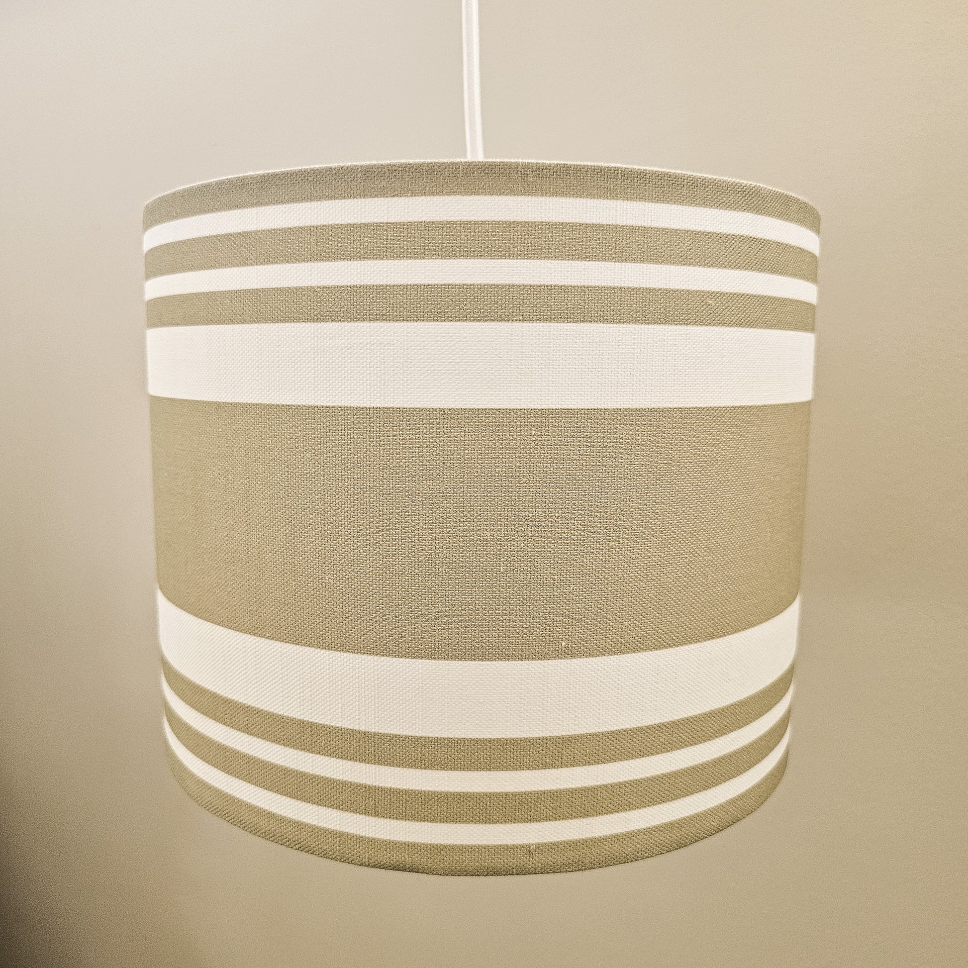 Handmade drum lampshade in Harbour Stripe fabric on neutral background — artisan home décor by ZIA LIVING.