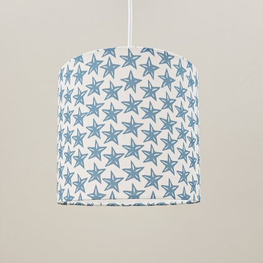 star lino print patterned lampshade in blue and white, as a ceiling pendant