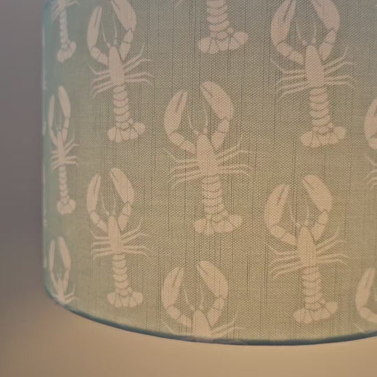 reel of me making a drum lampshade in lobster print fabrc